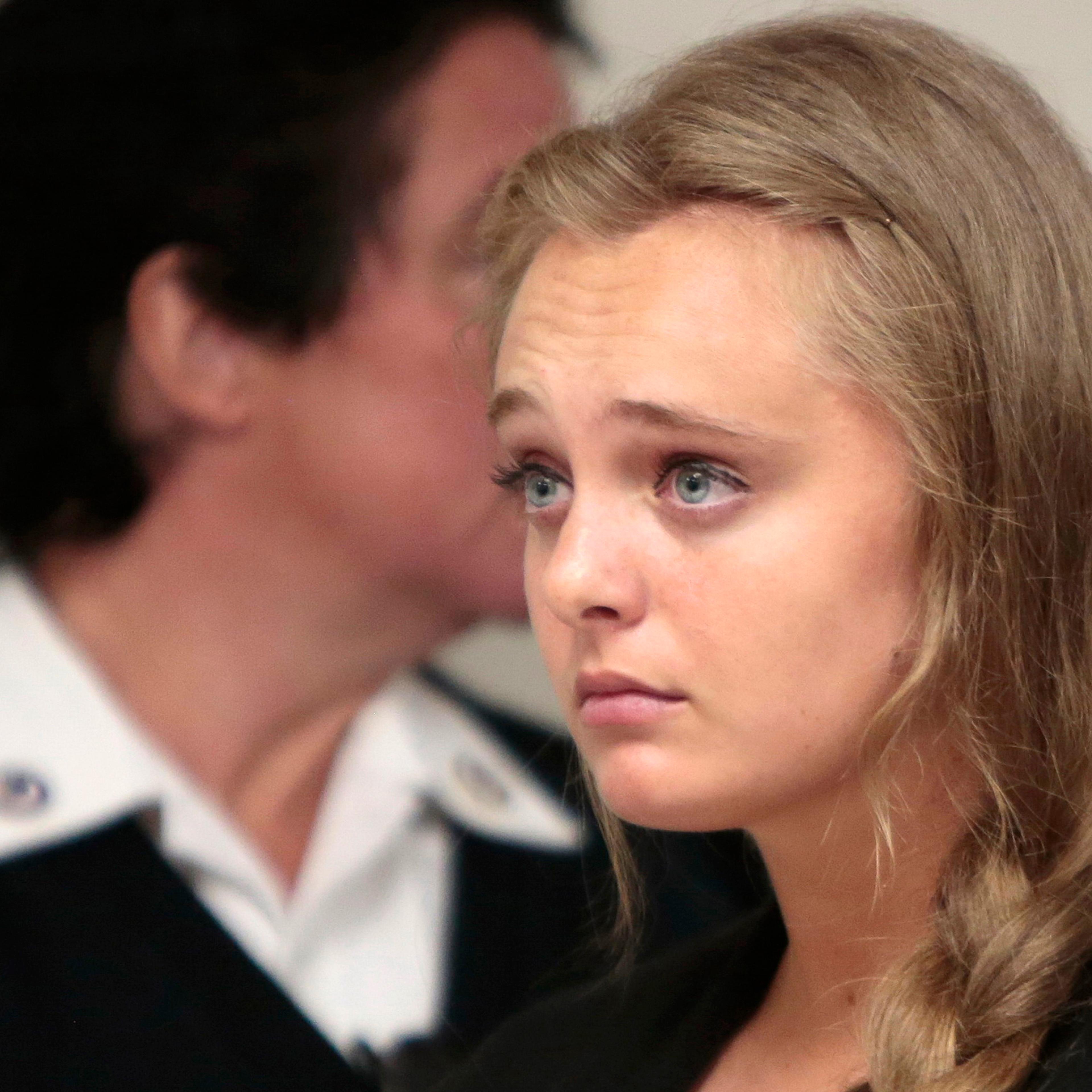 Michelle Carter listens to her defense attorney argue for an involuntary manslaughter charge against her to be dismissed at Juvenile Court in New Bedford, Mass. on Aug. 24, 2015.