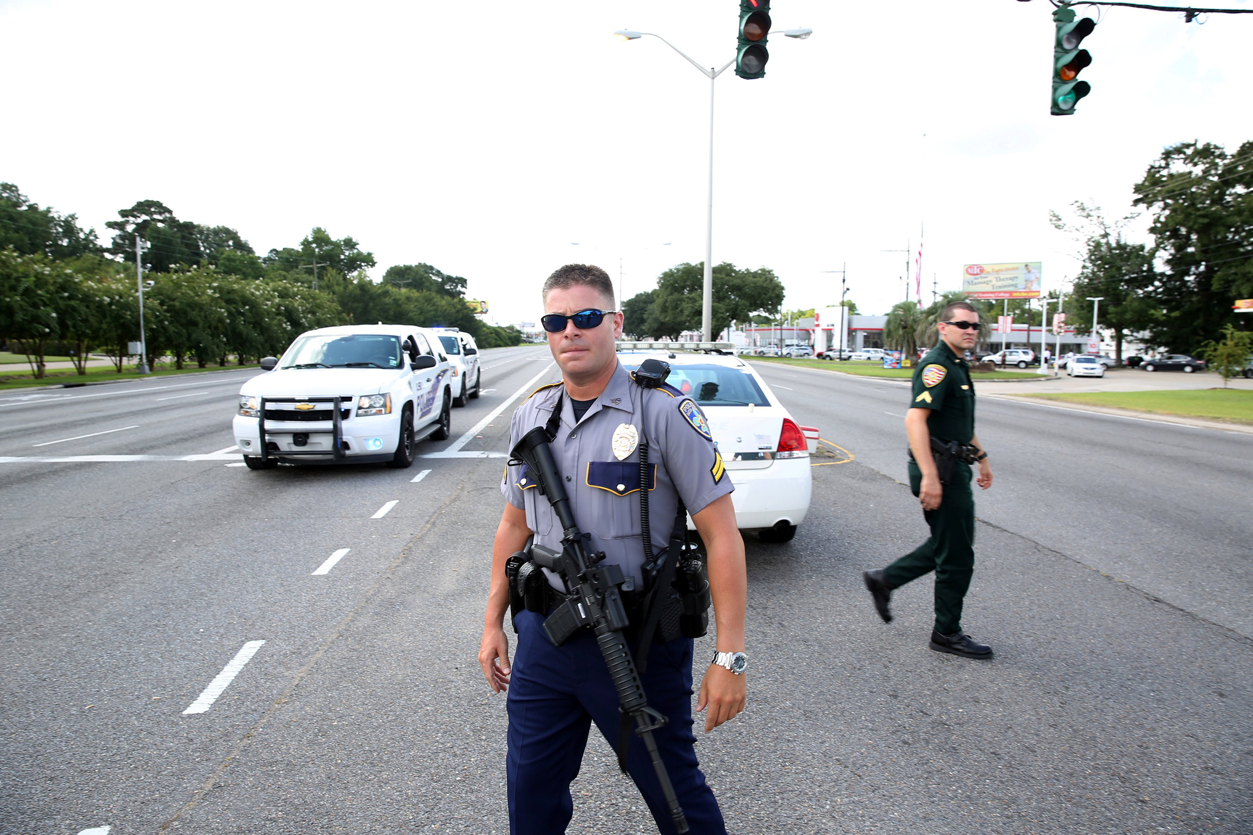 Police officers block off a road after a shooting of police in Baton Rouge, Louisiana, July 17, 2016.