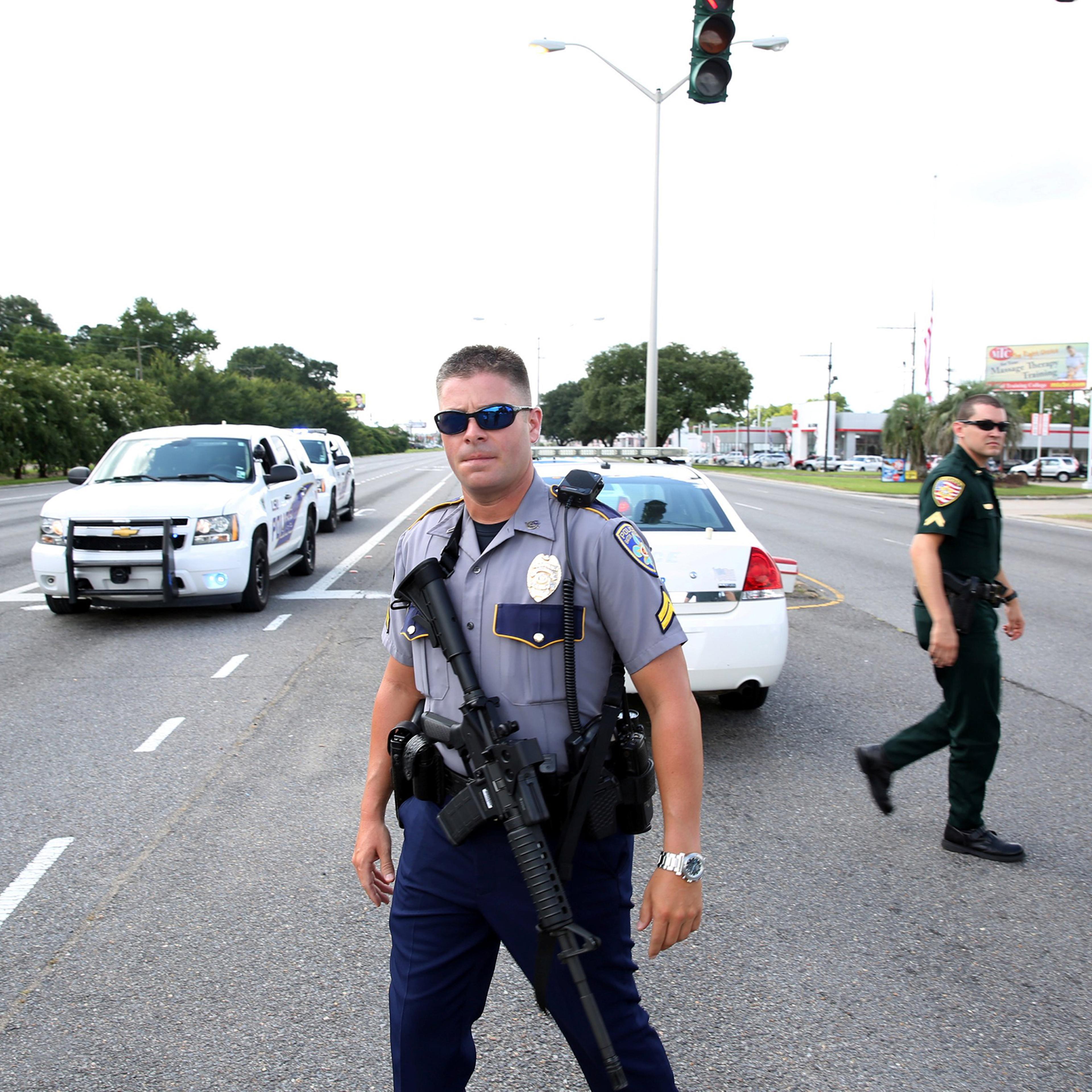 Police officers block off a road after a shooting of police in Baton Rouge, Louisiana, July 17, 2016.