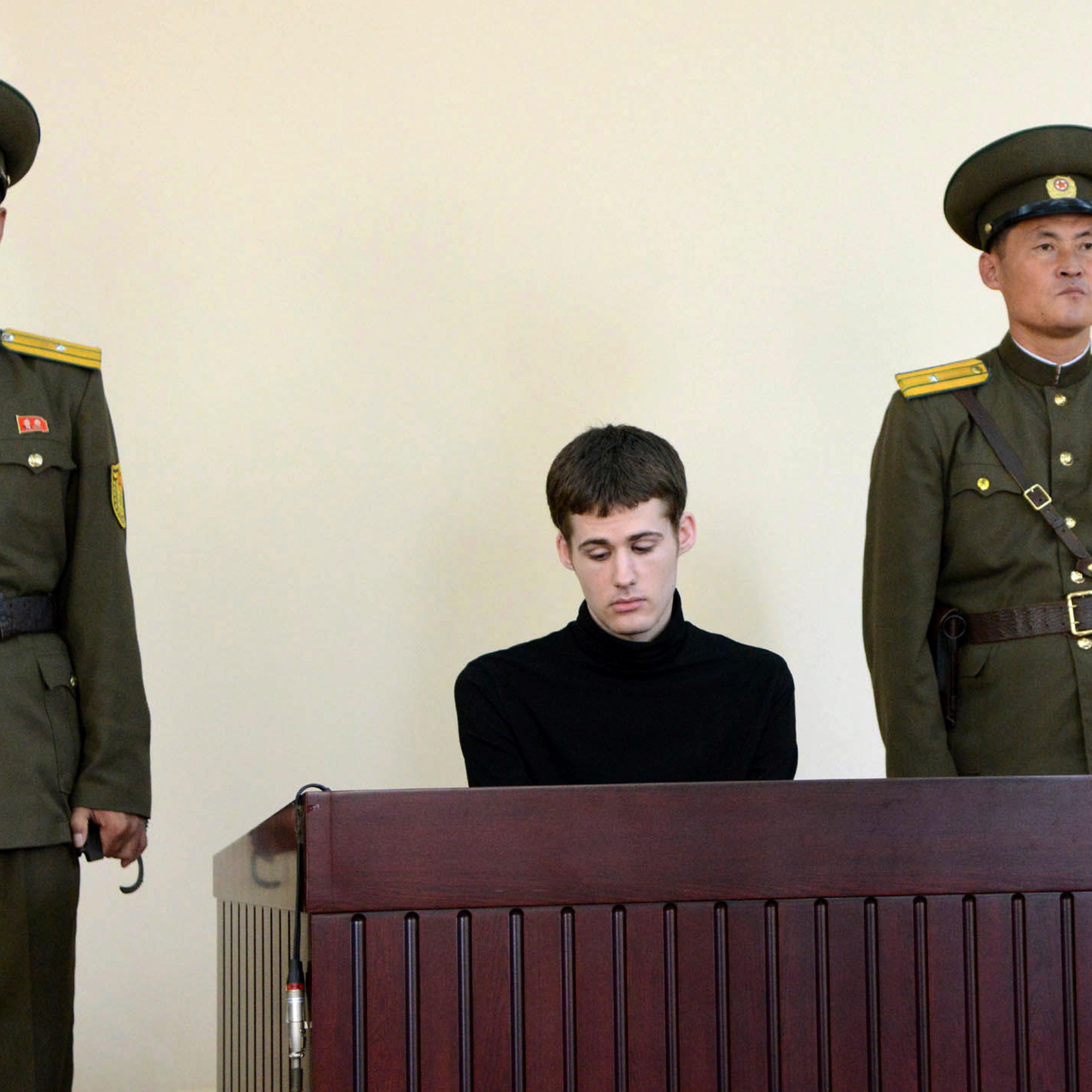 U.S. citizen Matthew Todd Miller sits in a witness box during his trial at the North Korean Supreme Court