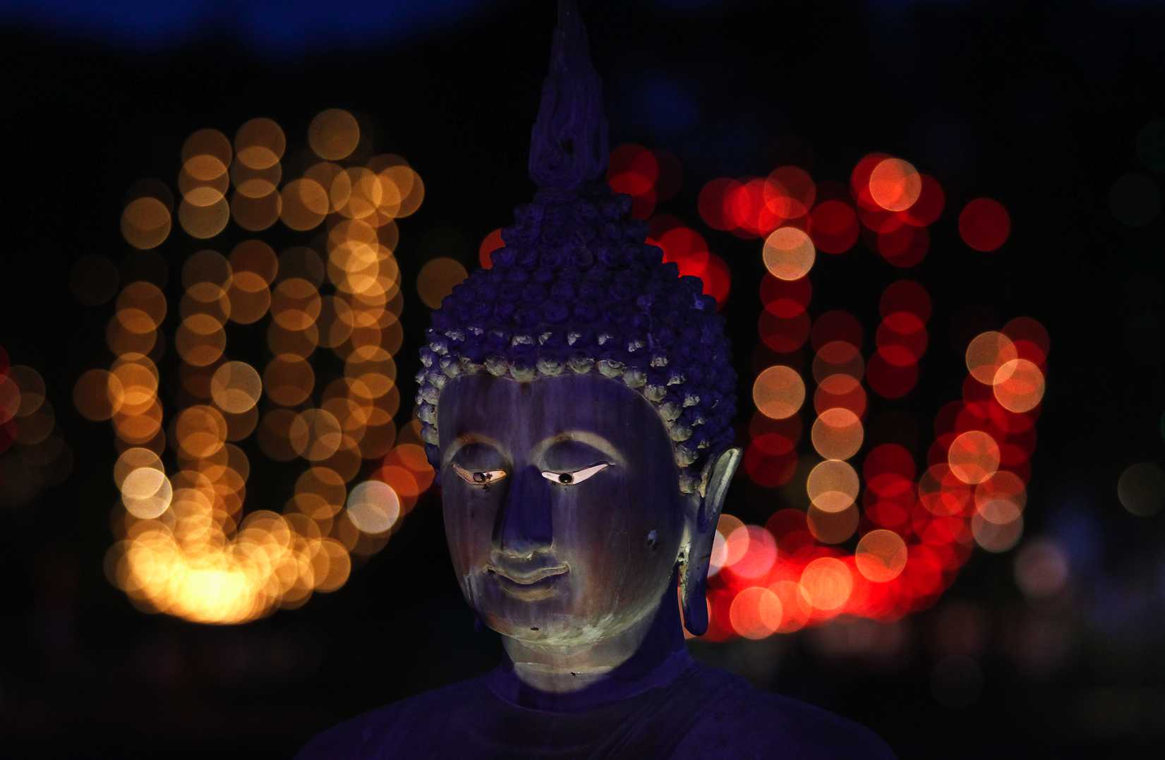 A Buddha statue at Gangaramaya Temple in Colombo, Sri Lanka, on May 26, 2013