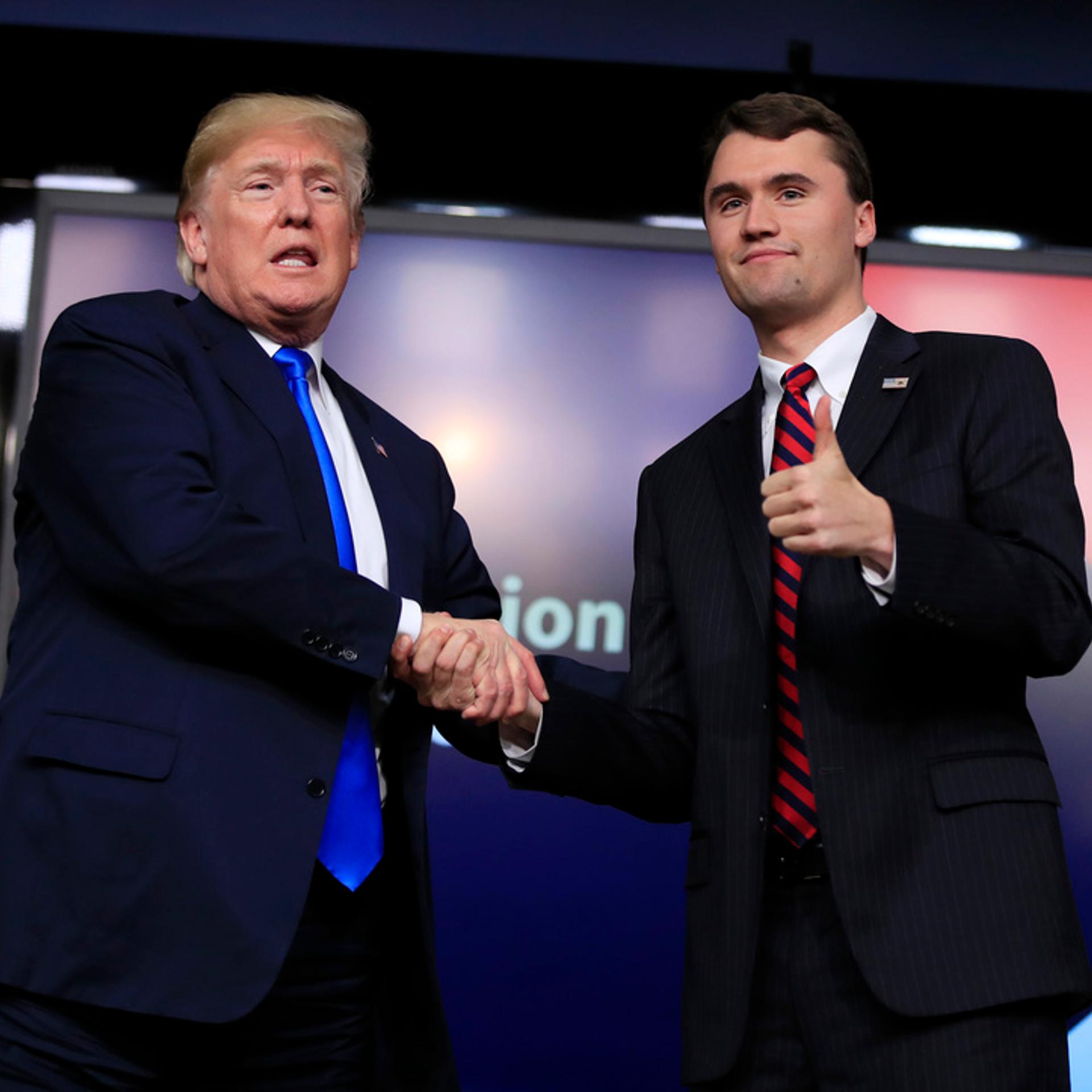 President Donald Trump shakes hands with moderator Charlie Kirk, during a Generation Next White House forum at the Eisenhower Executive Office Building on the White House complex in Washington, Thursday, March 22, 2018.