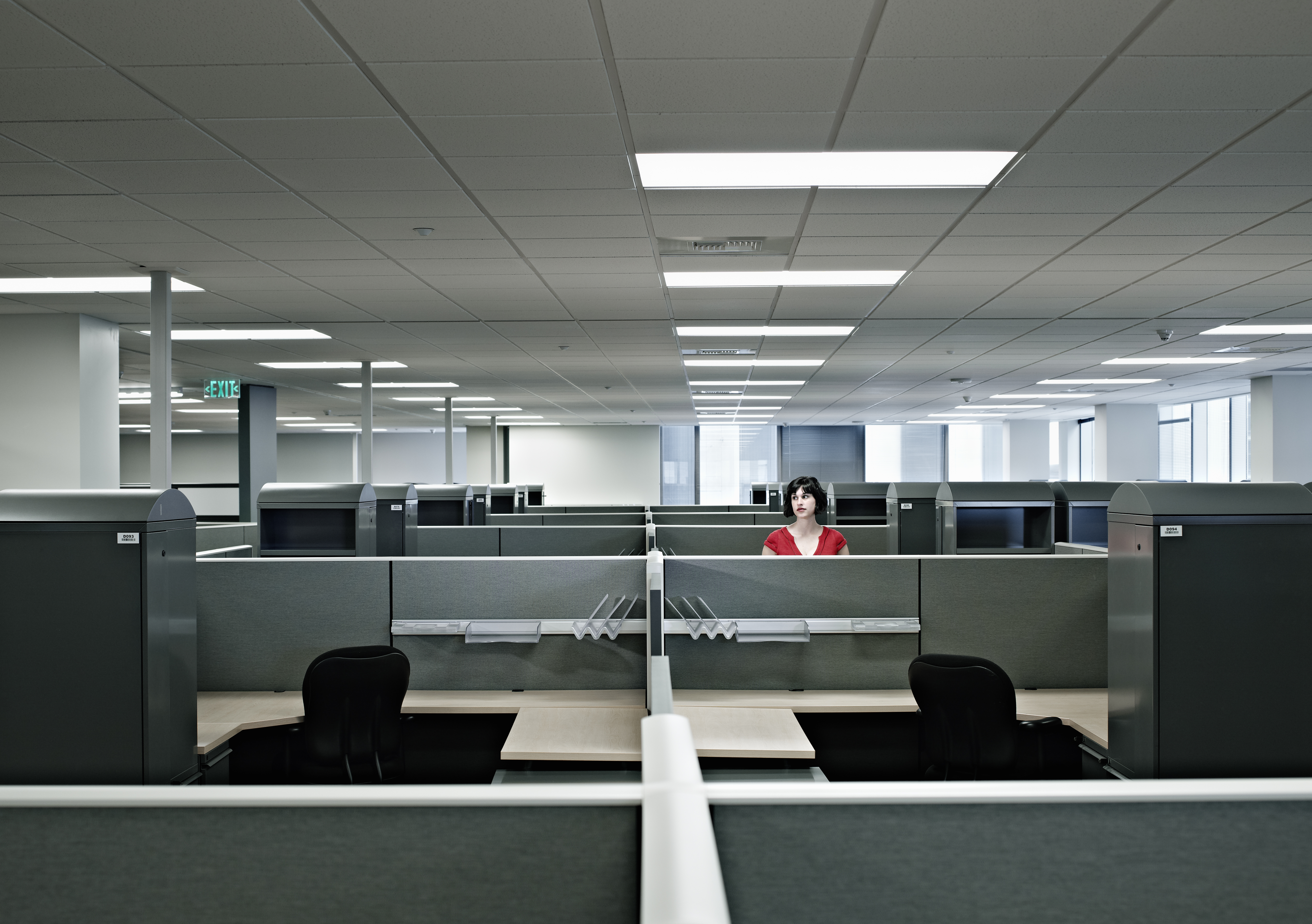 Businesswoman standing alone in empty office
