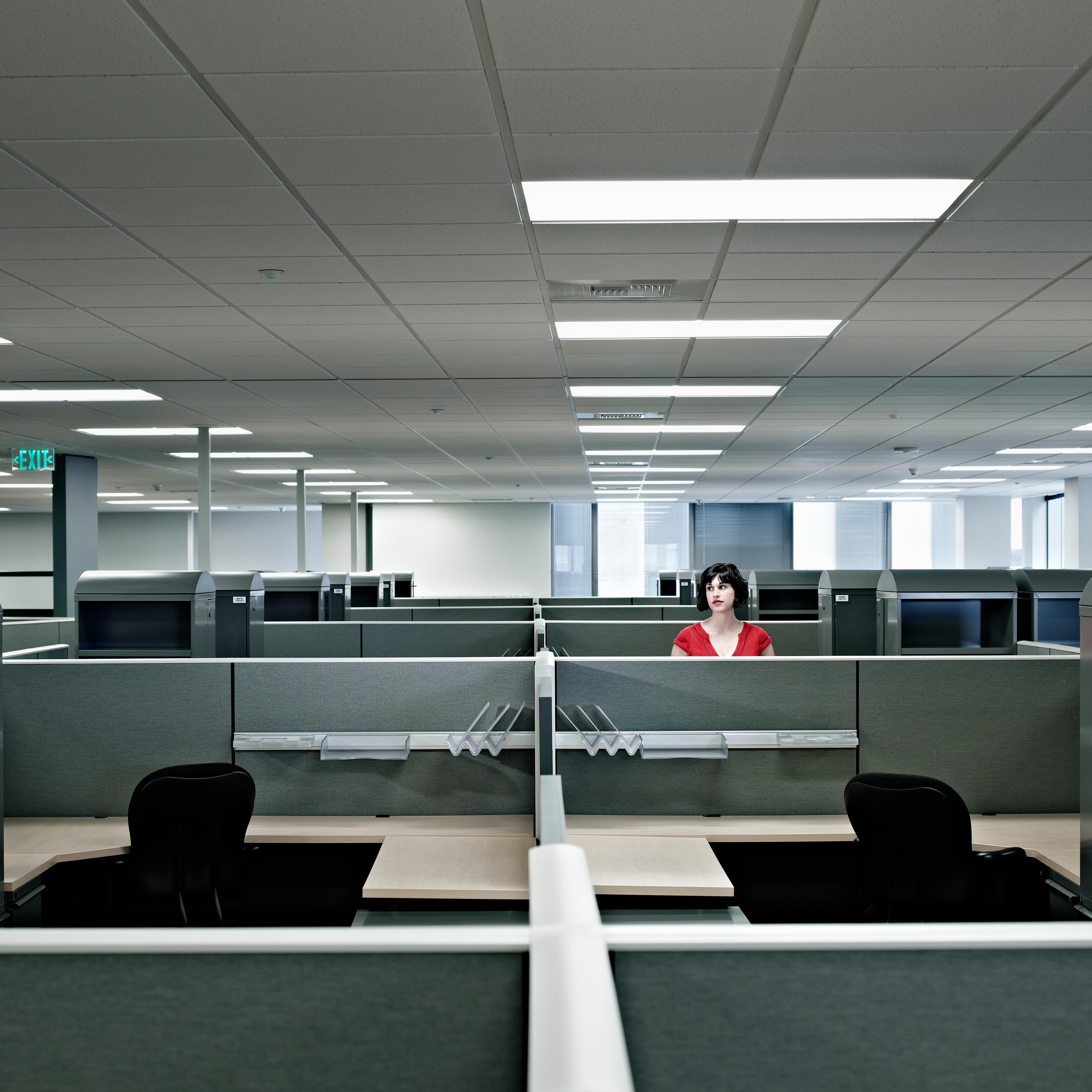 Businesswoman standing alone in empty office