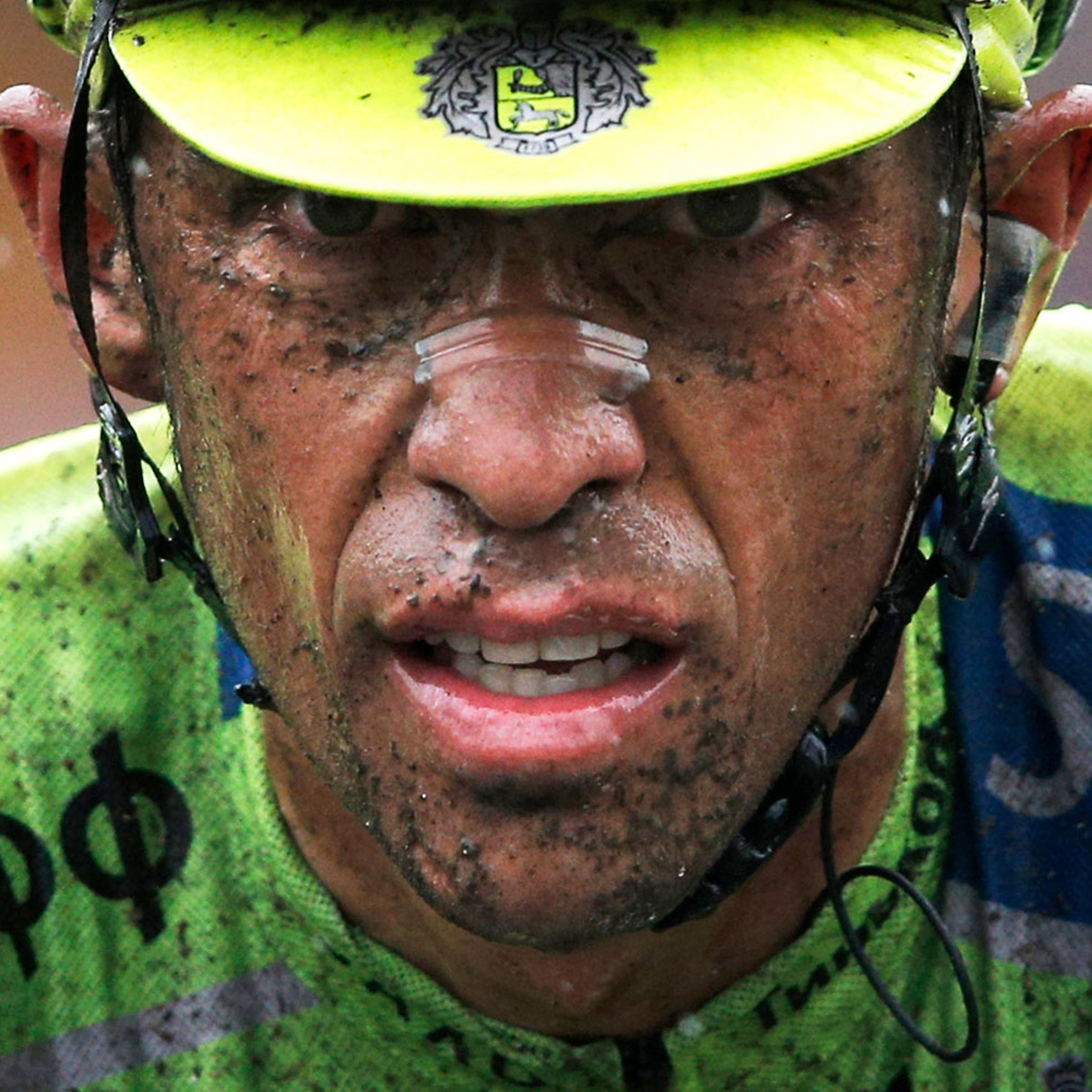 Spain's Alberto Contador crosses the finish line with a delay of more than two minutes on his main rivals during the fifth stage of the Tour de France cycling in Arenberg, France on July 9, 2014.
