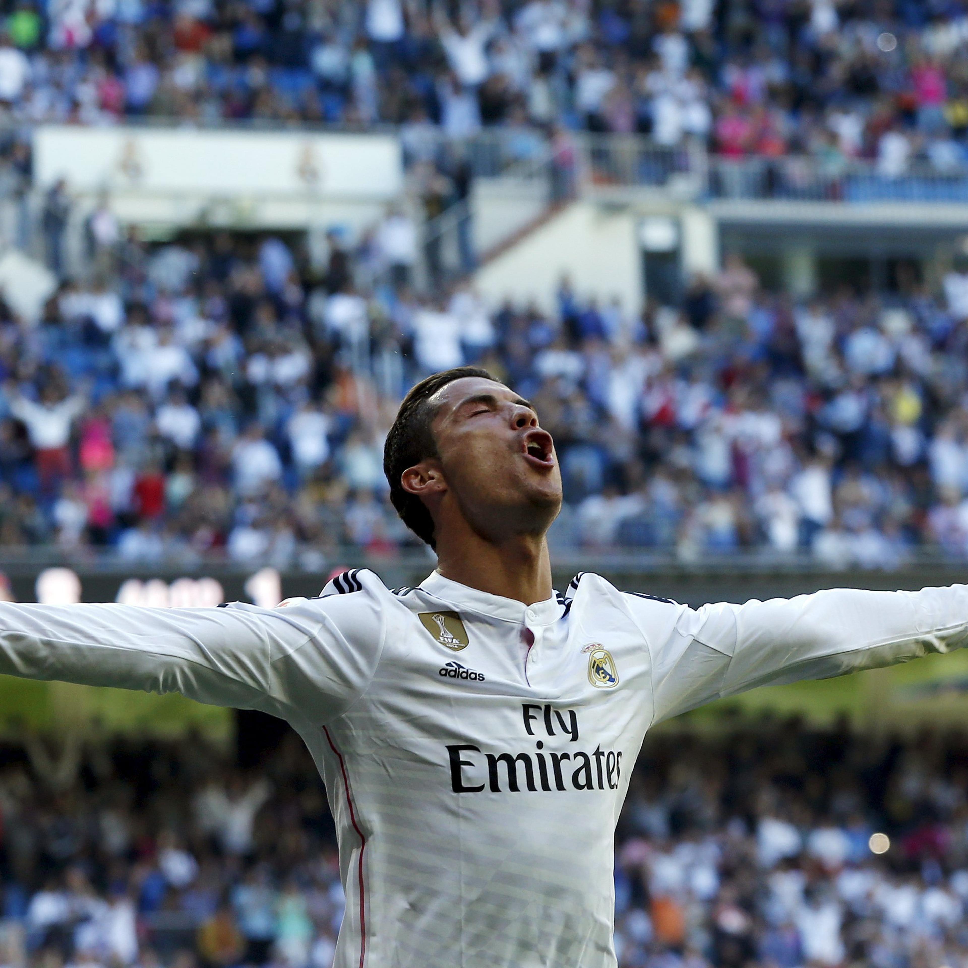Real Madrid's Cristiano Ronaldo celebrates his fifth goal against Granada during their Spanish first division soccer match at Santiago Bernabeu stadium in Madrid