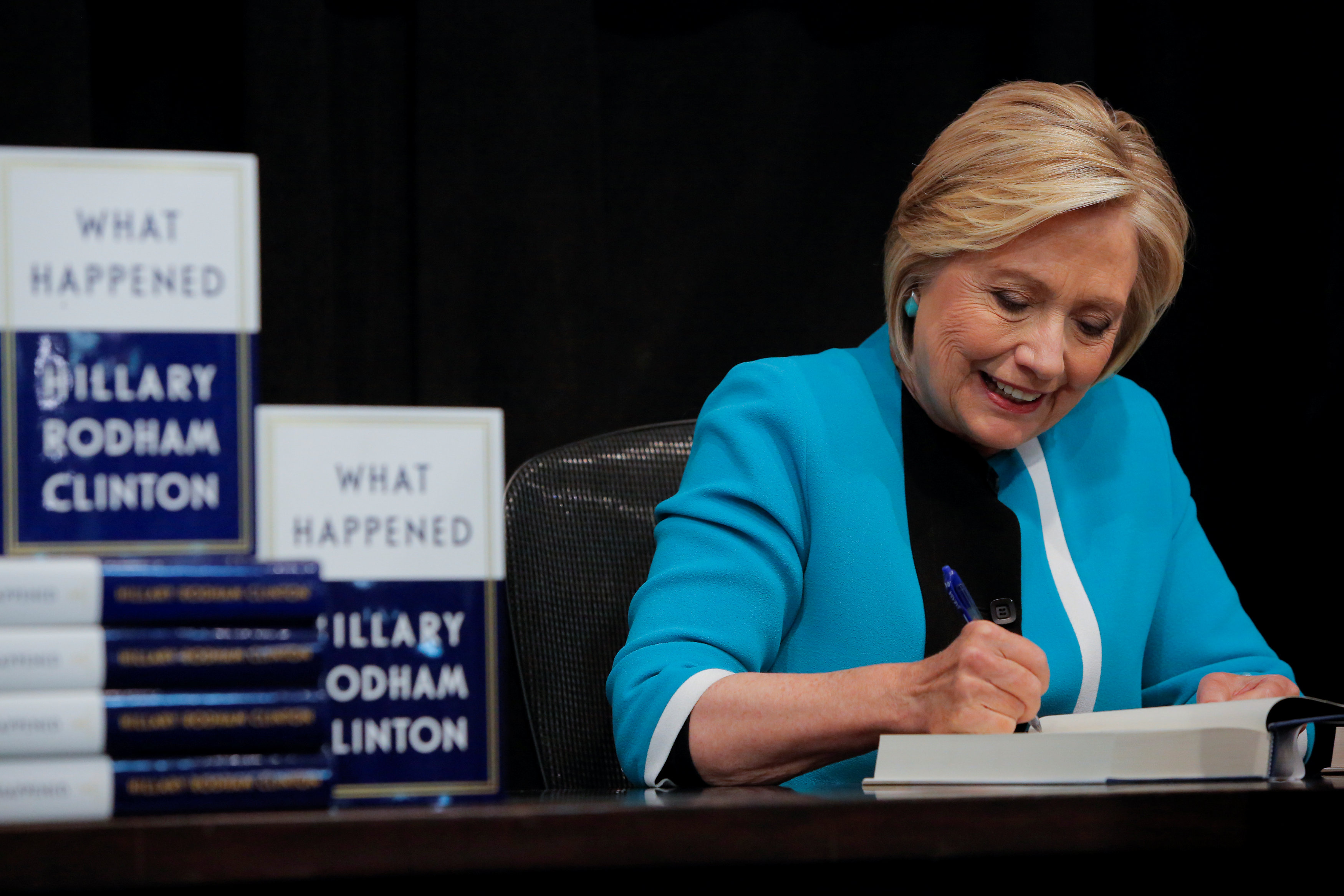 Former Secretary of State Hillary Clinton signs a copy of her new book 'What happened' at Barnes & Noble bookstore at Union Square in Manhattan, New York