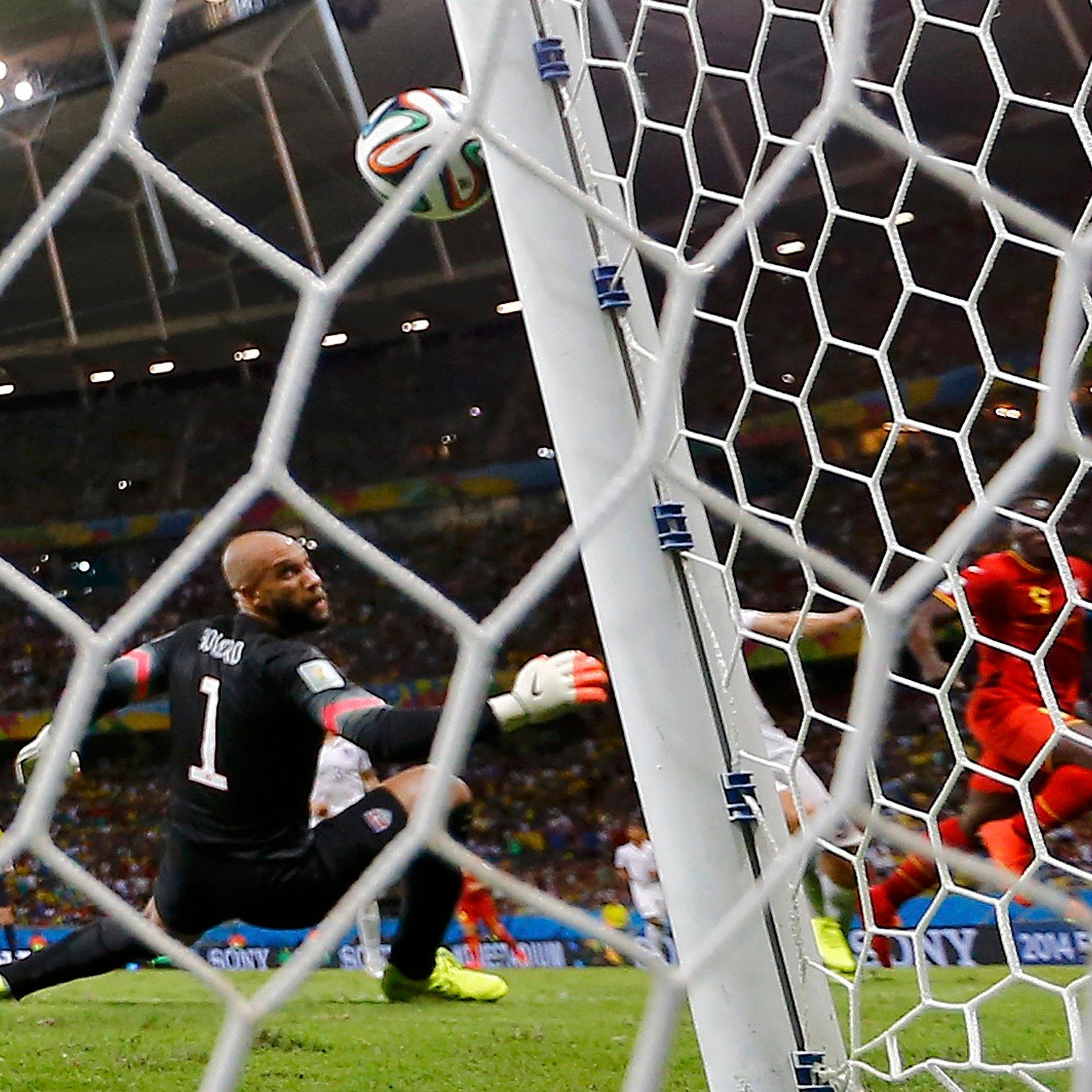 Belgium's Romelu Lukaku (2nd R) scores his team's second goal past Goalkeeper Tim Howard of the U.S. during extra time in their game at the Fonte Nova arena in Salvador, Brazil on July 1, 2014.