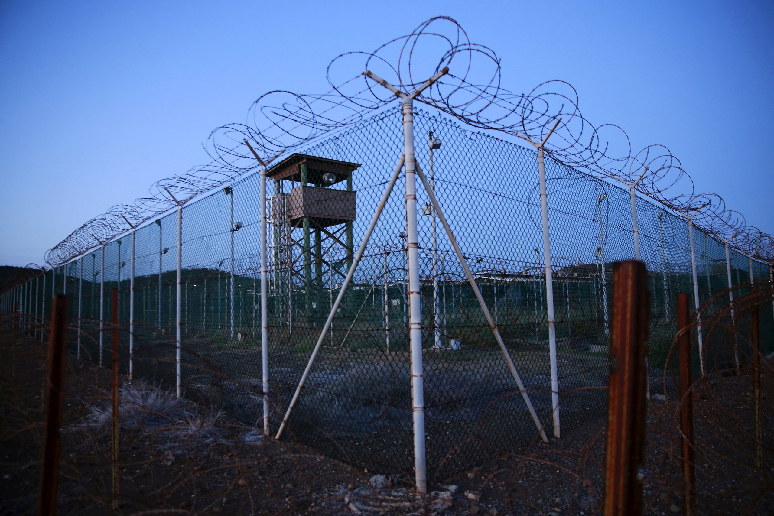 Chain link fence and concertina wire surrounds a deserted guard tower within Joint Task Force Guantanamo's Camp Delta at the U.S. Naval Base in Guantanamo Bay, Cuba March 21, 2016.