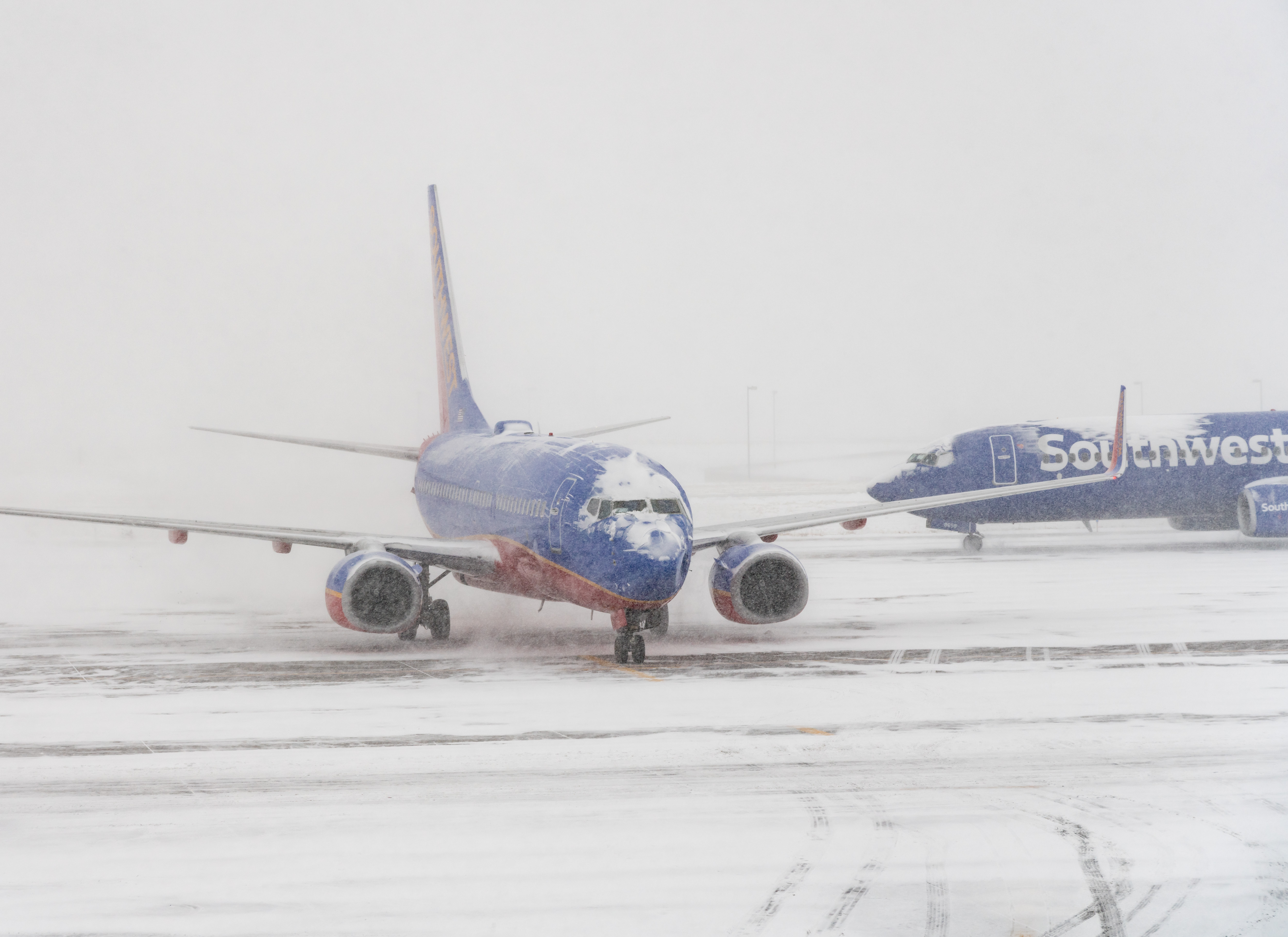 Southwest aircraft on the runway during snow storm in Denver