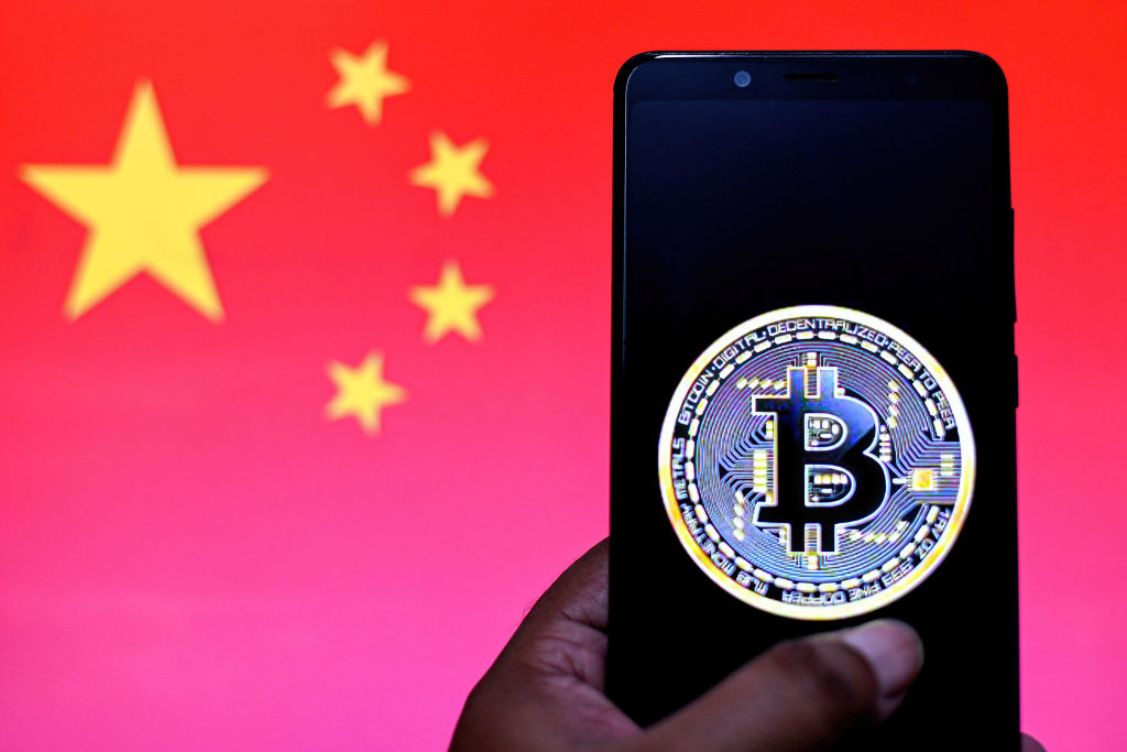 In this Photo illustration a Bitcoin logo seen displayed on