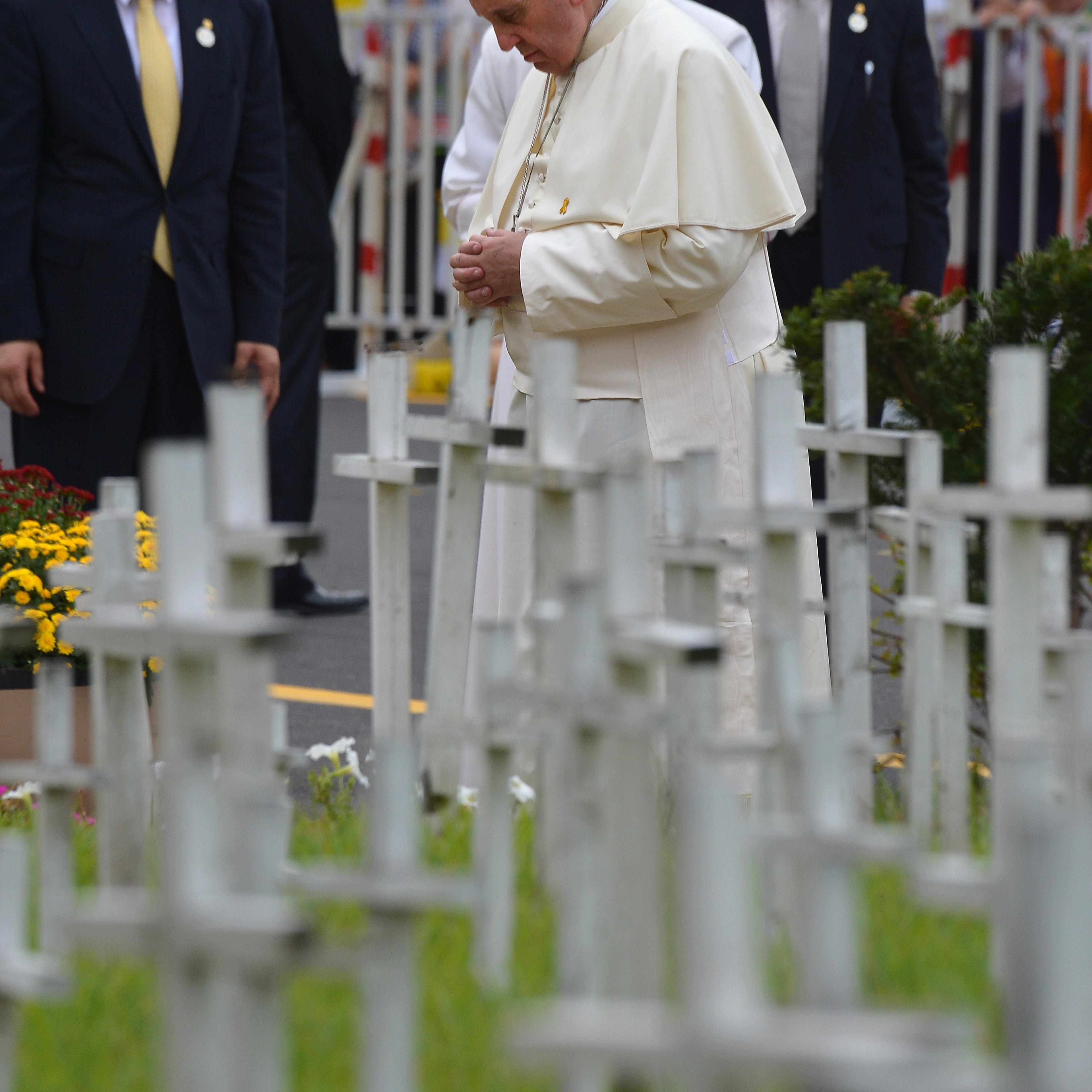 Pope Francis stops to pray during a visit to the "garden for aborted babies" in Kkottongnae, around 80 kilometres south of Seoul, on Aug. 16, 2014.