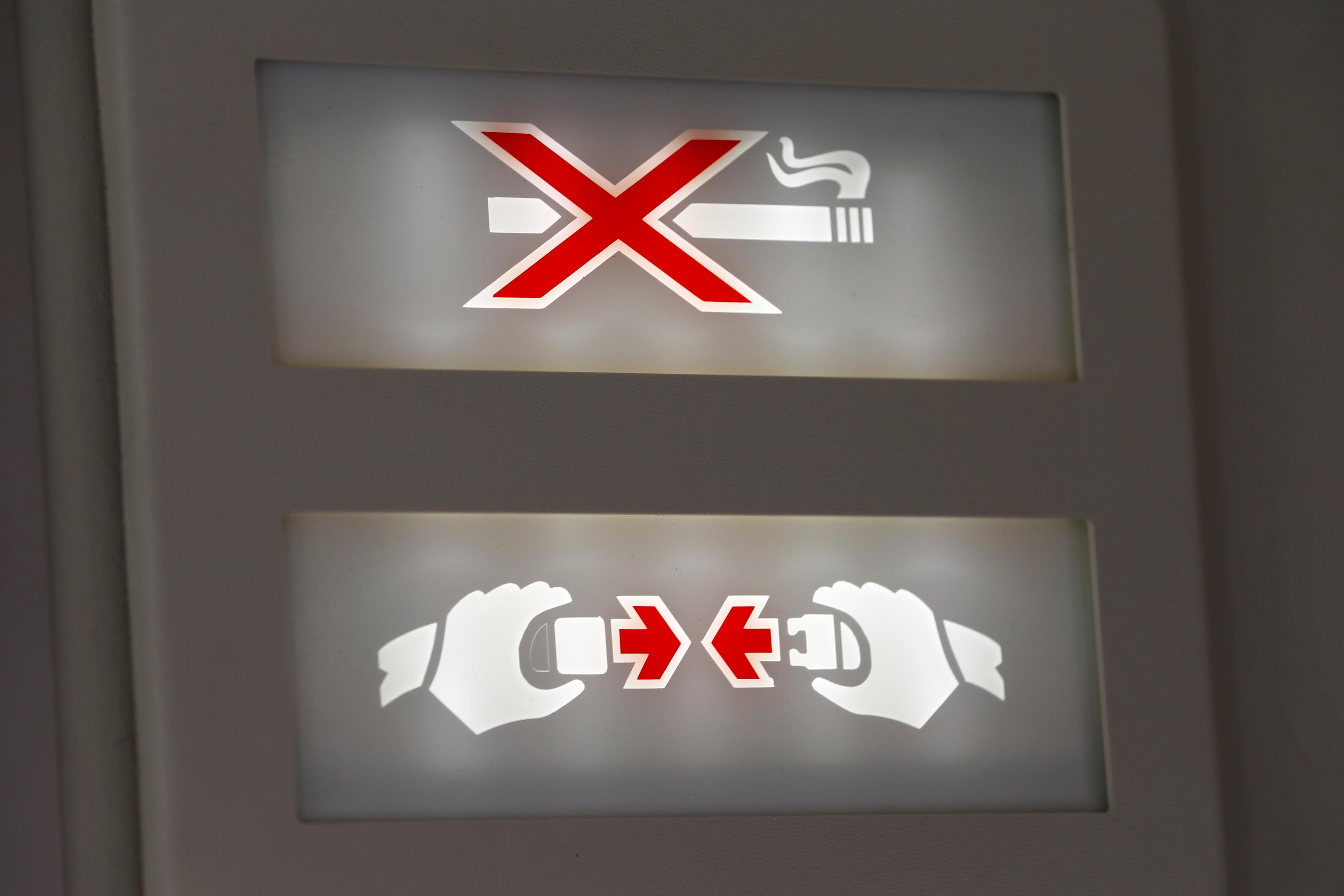 A "Fasten Your Seatbelt" and "No Smoking" sign is pictured in a Swiss Air Force Twin Otter aircraft in Belp