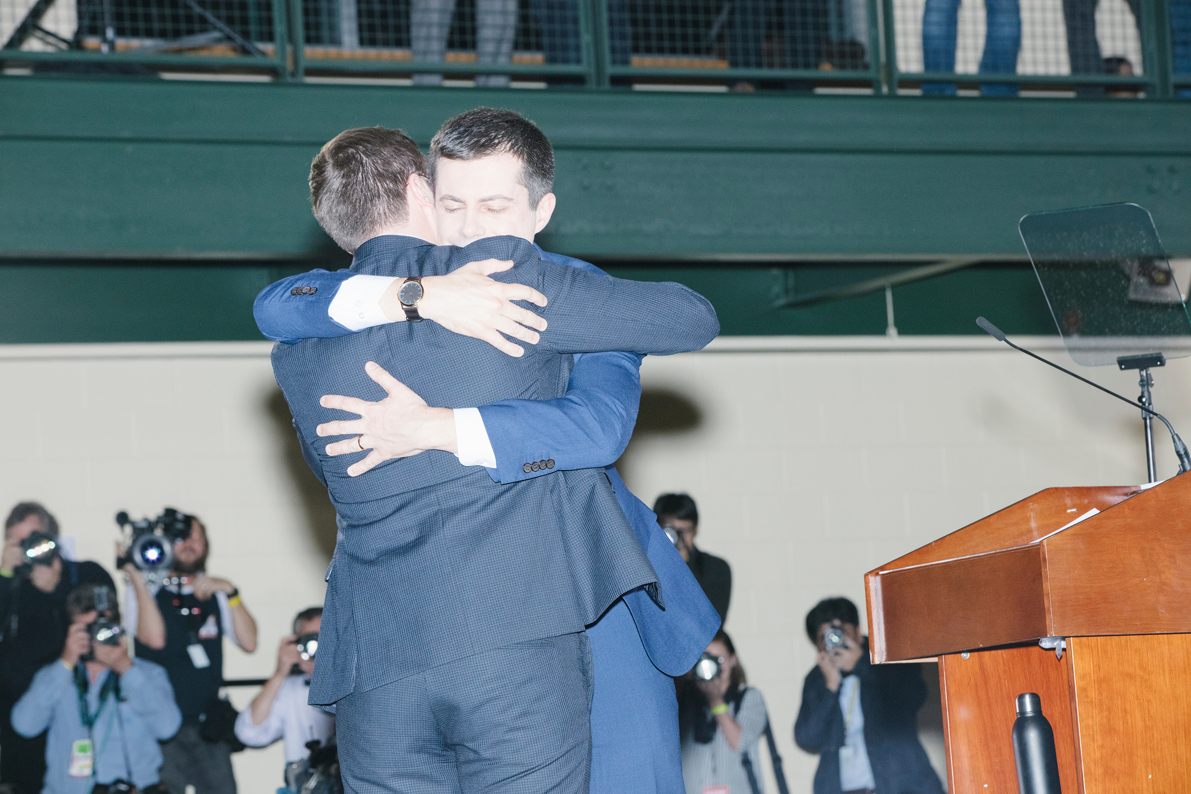 Pete Buttigieg, Democratic presidential candidate and former South Bend, Ind., mayor, embraces husband Chasten at a rally in Nashua, N.H., on Feb. 11, 2020.