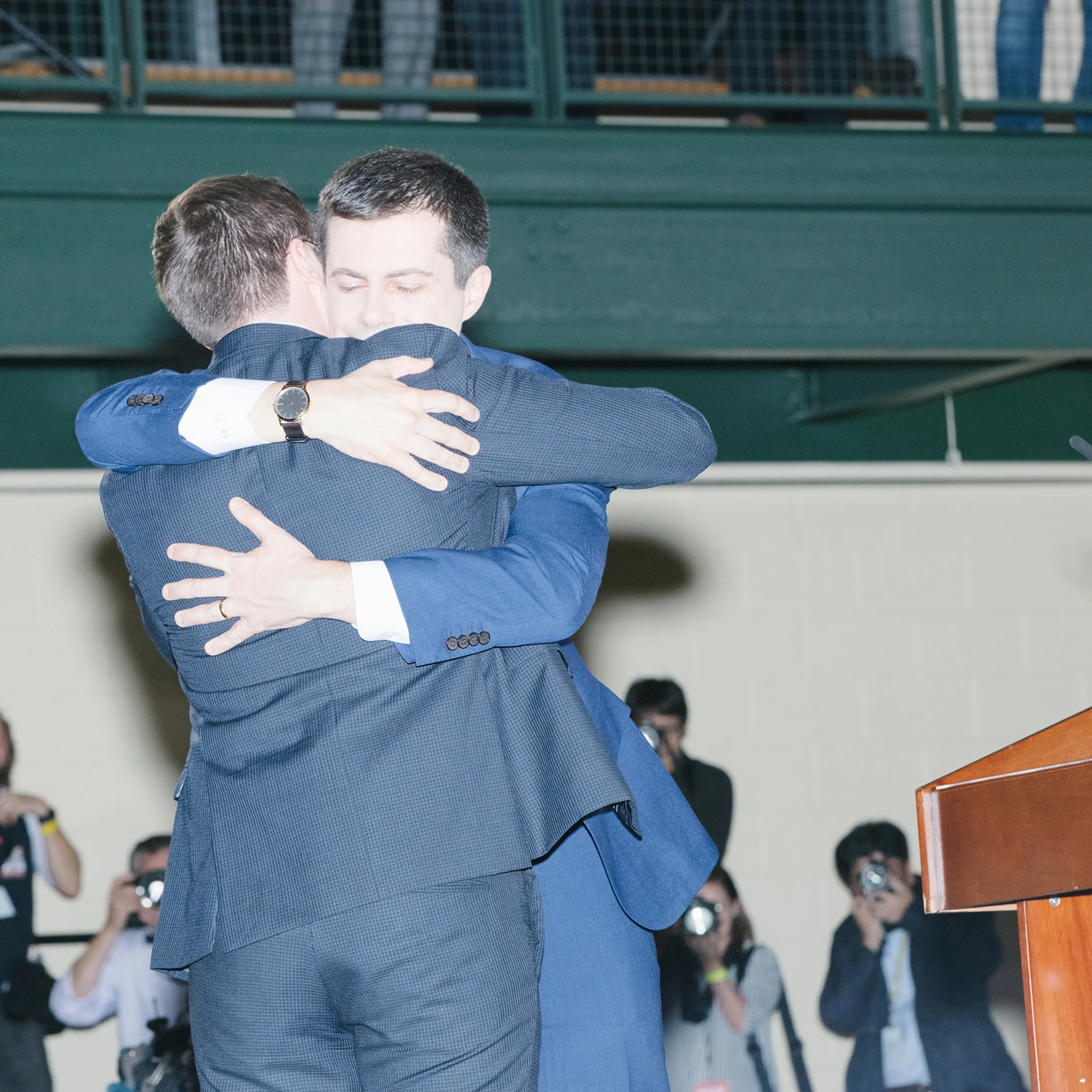 Pete Buttigieg, Democratic presidential candidate and former South Bend, Ind., mayor, embraces husband Chasten at a rally in Nashua, N.H., on Feb. 11, 2020.
