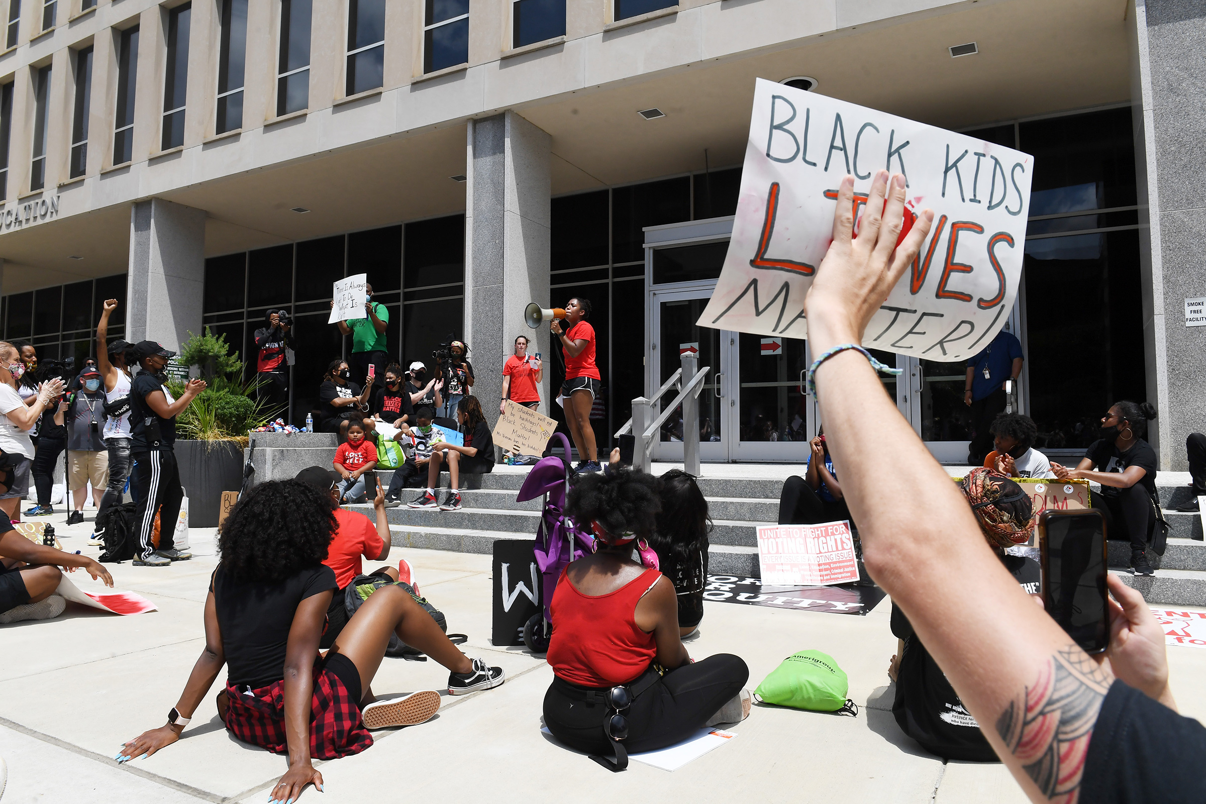 Demonstrators gather outside the U.S. Department of Education for the Black Students Matter march, organized by Educators for Equity on June 19 in Washington, DC.