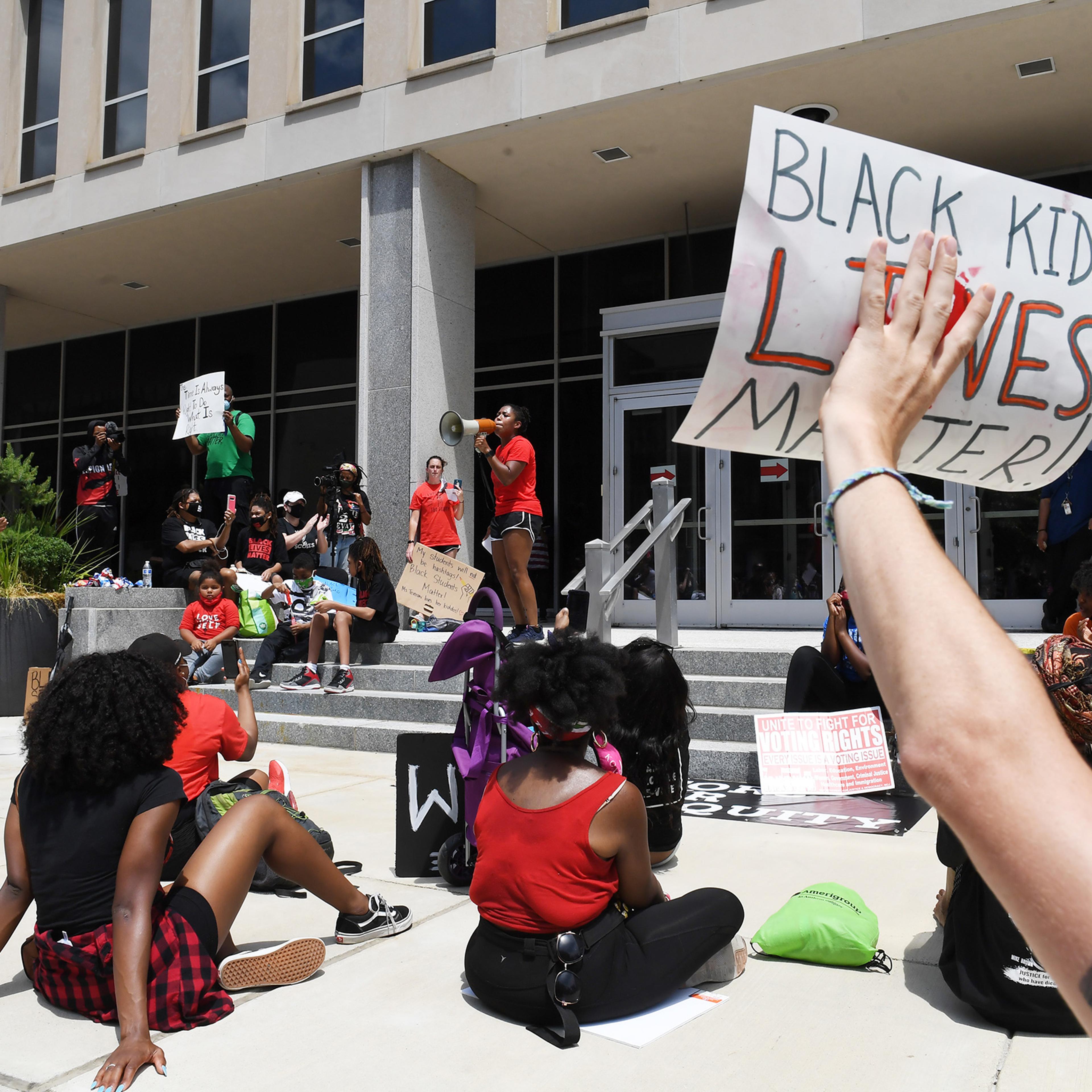 Demonstrators gather outside the U.S. Department of Education for the Black Students Matter march, organized by Educators for Equity on June 19 in Washington, DC.