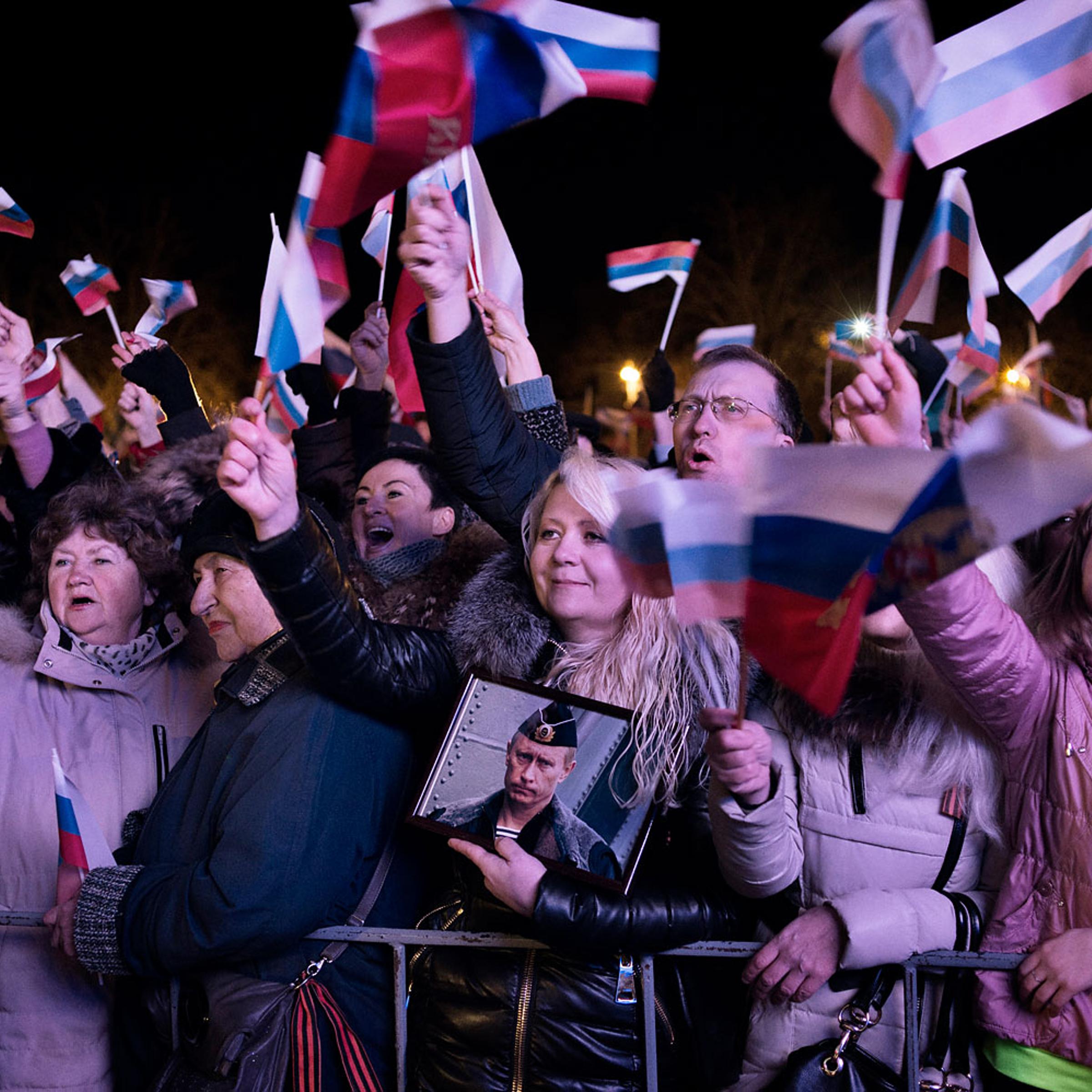 A jubilant crowd in Crimea waits for the results of the referendum in the Crimean city of Sevastopol on March 16, 2014.