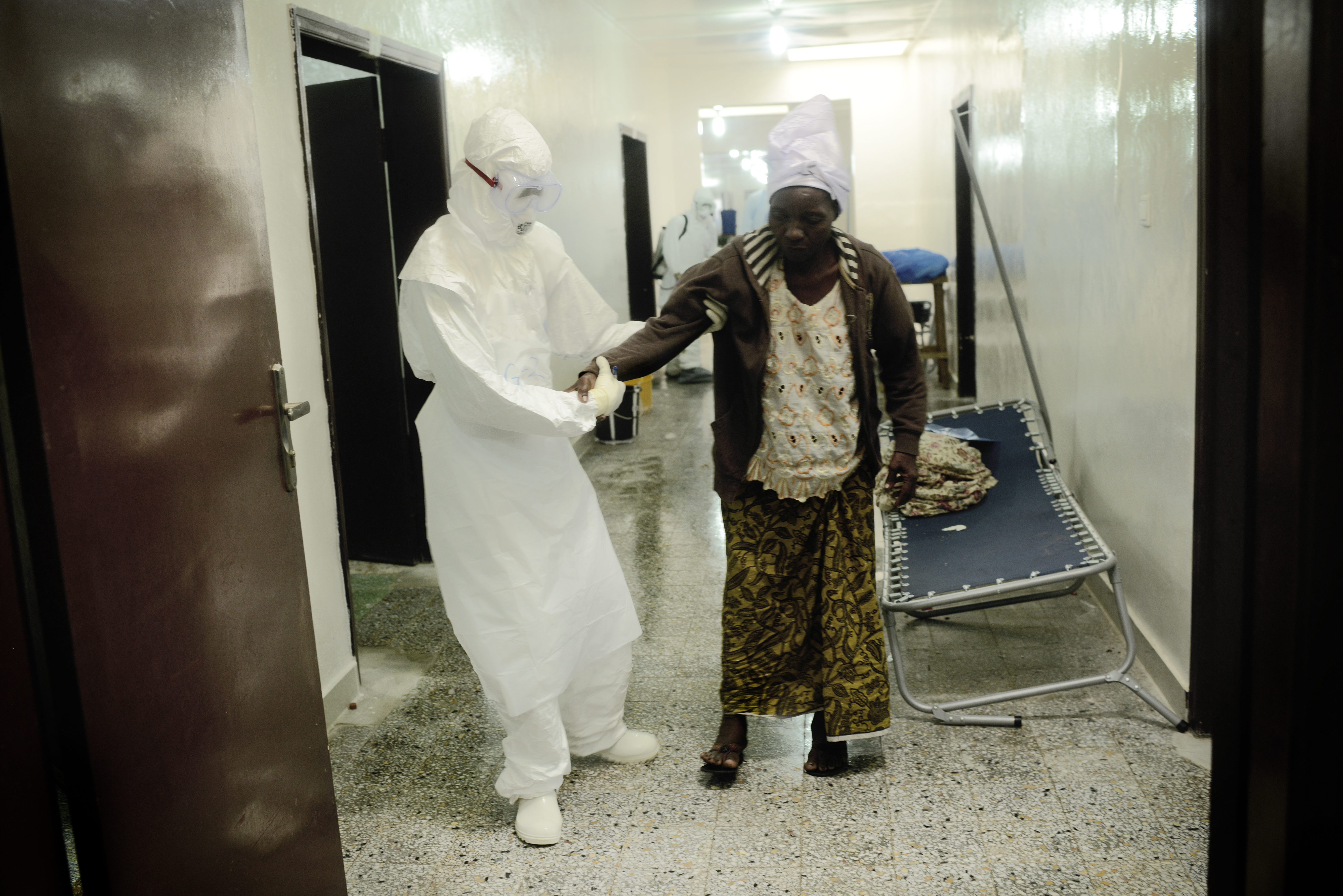 Benedicte Kurzen, September 2014."From early morning till late in the afternoon, we followed the Liberian Red Cross. They have a list of people who died and they go to their communities to collect the bodies. Every time the Red Cross workers do the same 