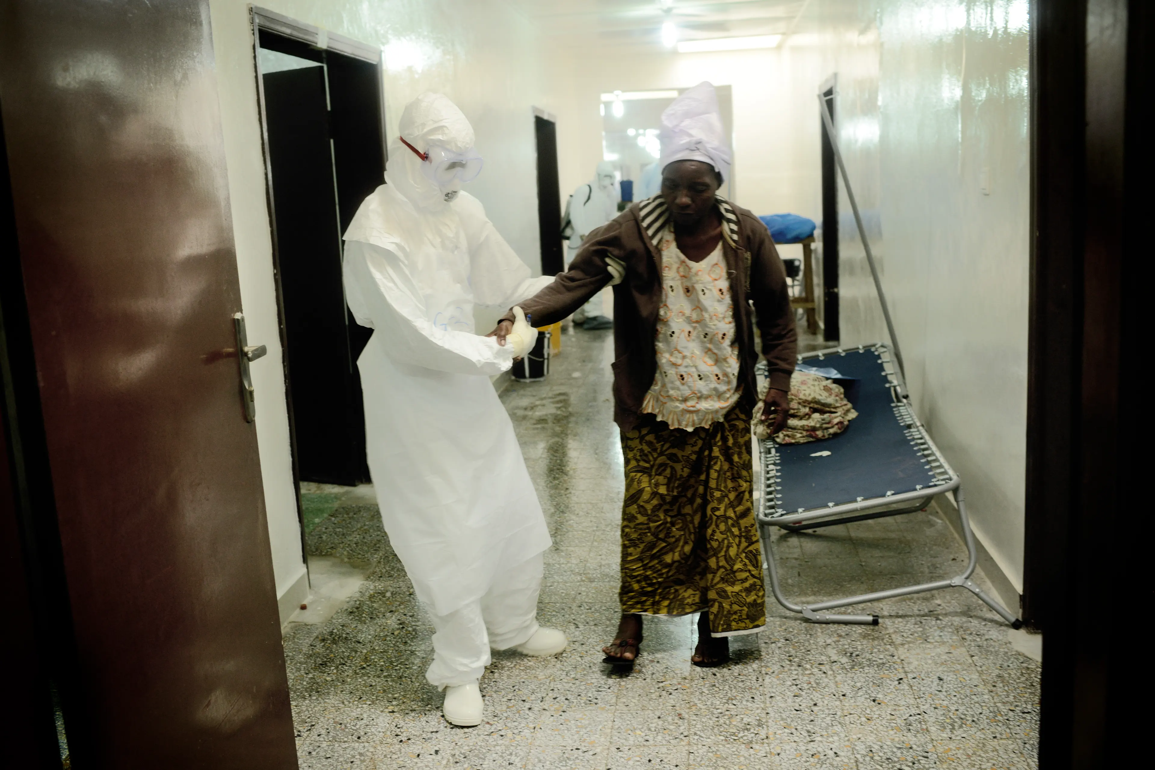 Benedicte Kurzen, September 2014."From early morning till late in the afternoon, we followed the Liberian Red Cross. They have a list of people who died and they go to their communities to collect the bodies. Every time the Red Cross workers do the same