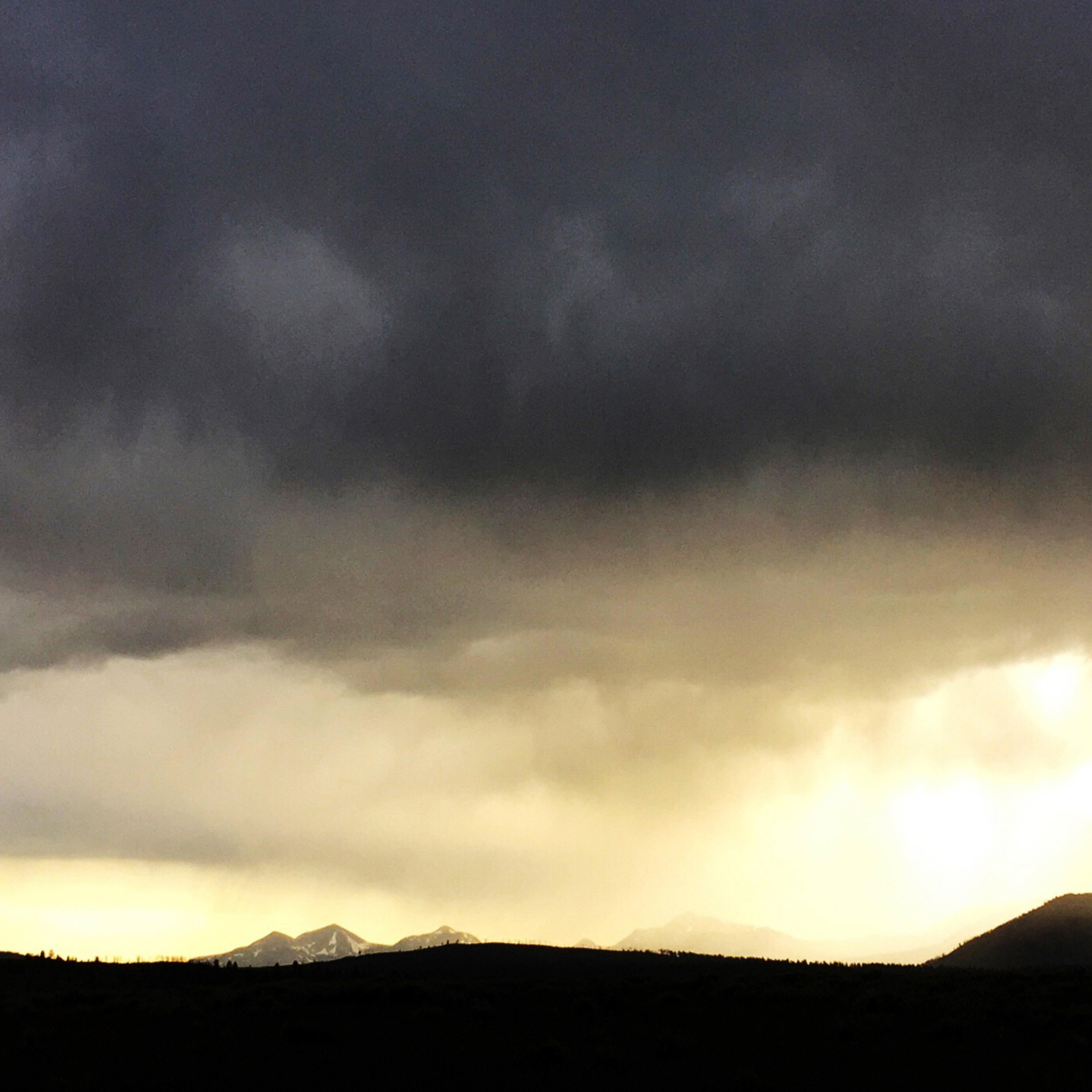 A rain shower moves over the Lamar Valley in Yellowstone National Park, Wyo. in June. A gaping hole in the earth has opened up in rural Wyoming, due in part to this year’s rainy spring.