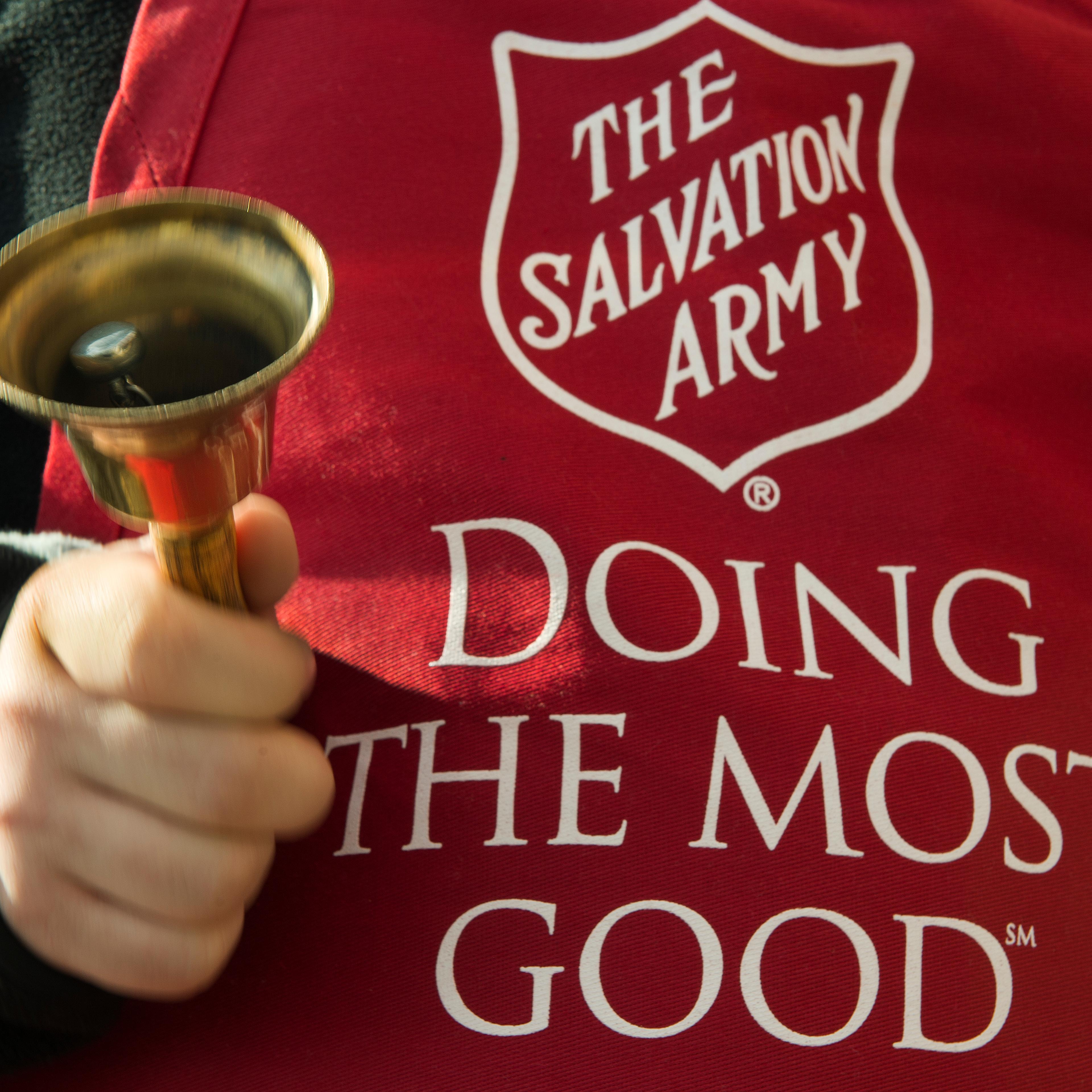 Salvation Army volunteer rings the collection bell outside a grocery store on Nov. 24, 2012 in Clifton, Virginia.
