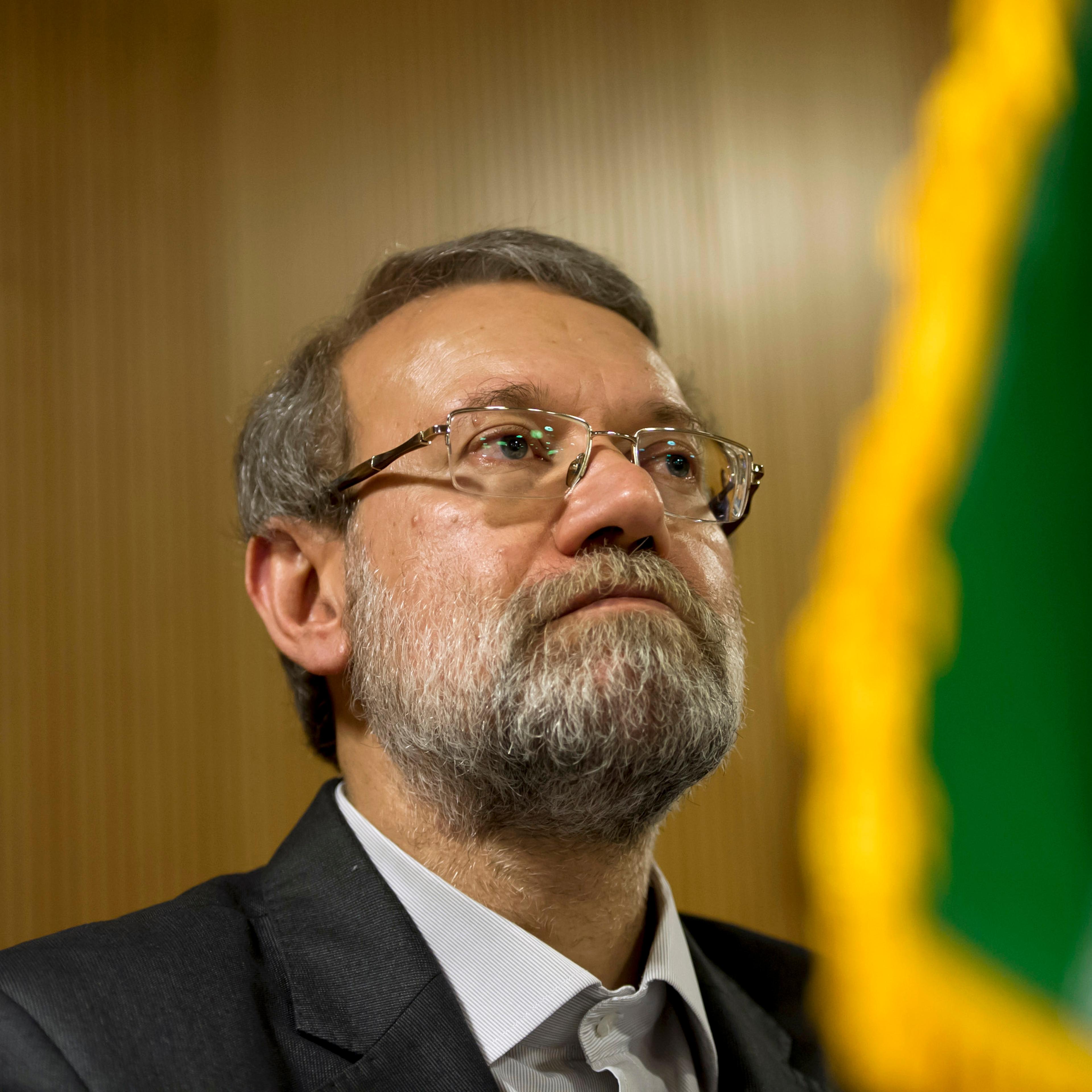 Ali Larijani speaks to members of the press aside of an International Parliamentary Union assembly on October 9, 2013 in Geneva, Switzerland.