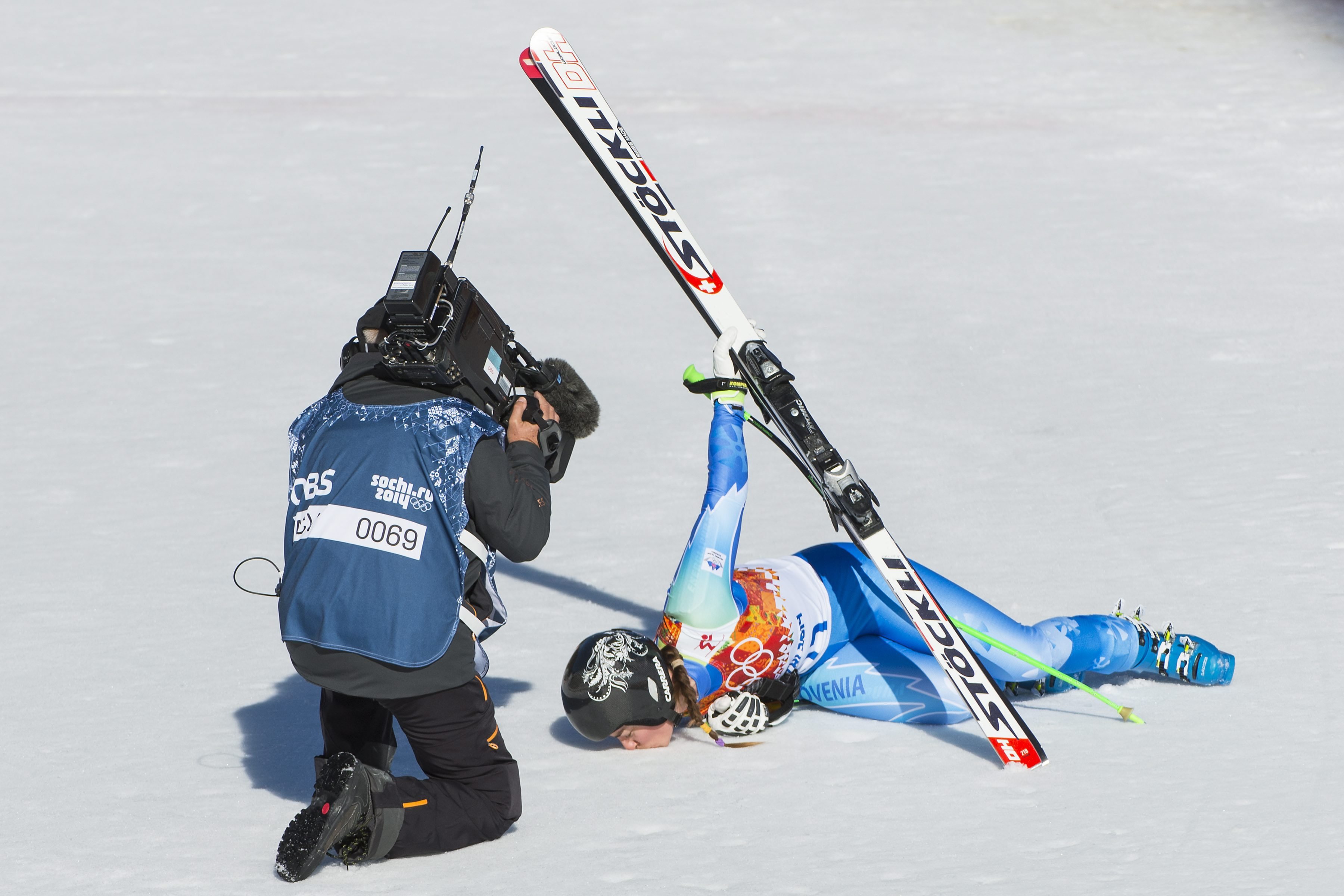 Tina Maze of Slovenia kisses the snow in the finish area during the Women's Alpine Skiing Downhill race in Rosa Khutor Alpine Center.