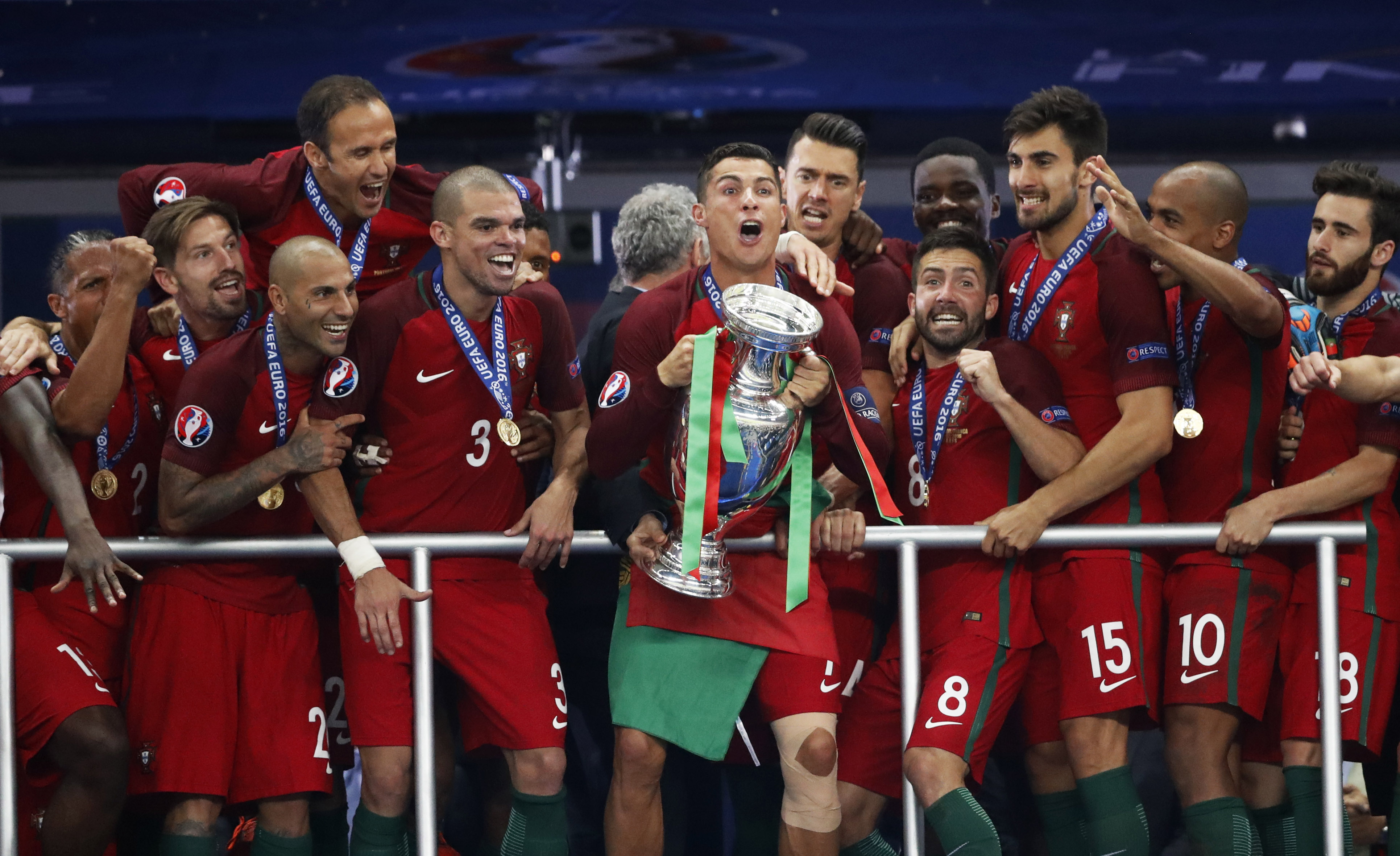 Portugal's Cristiano Ronaldo celebrates with team mates and the trophy after Portugal beat hosts France to win Euro 2016 at the Stade de France, Saint-Denis, near Paris on July 10, 2016.