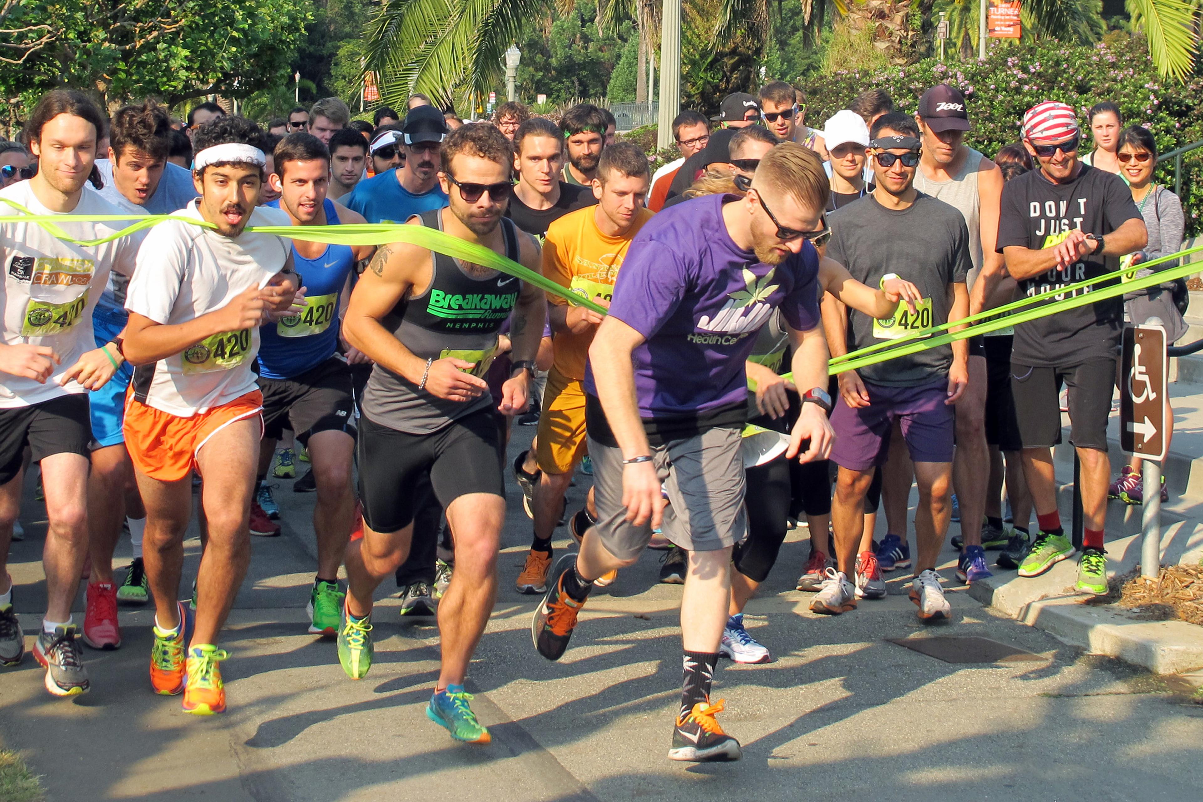 Runners take off in a 4.2-mile run, part of the 420 Games, an effort to stop the stigmatization of cannabis use through athletic events, at Golden Gate Park in San Francisco, Aug. 15, 2015.