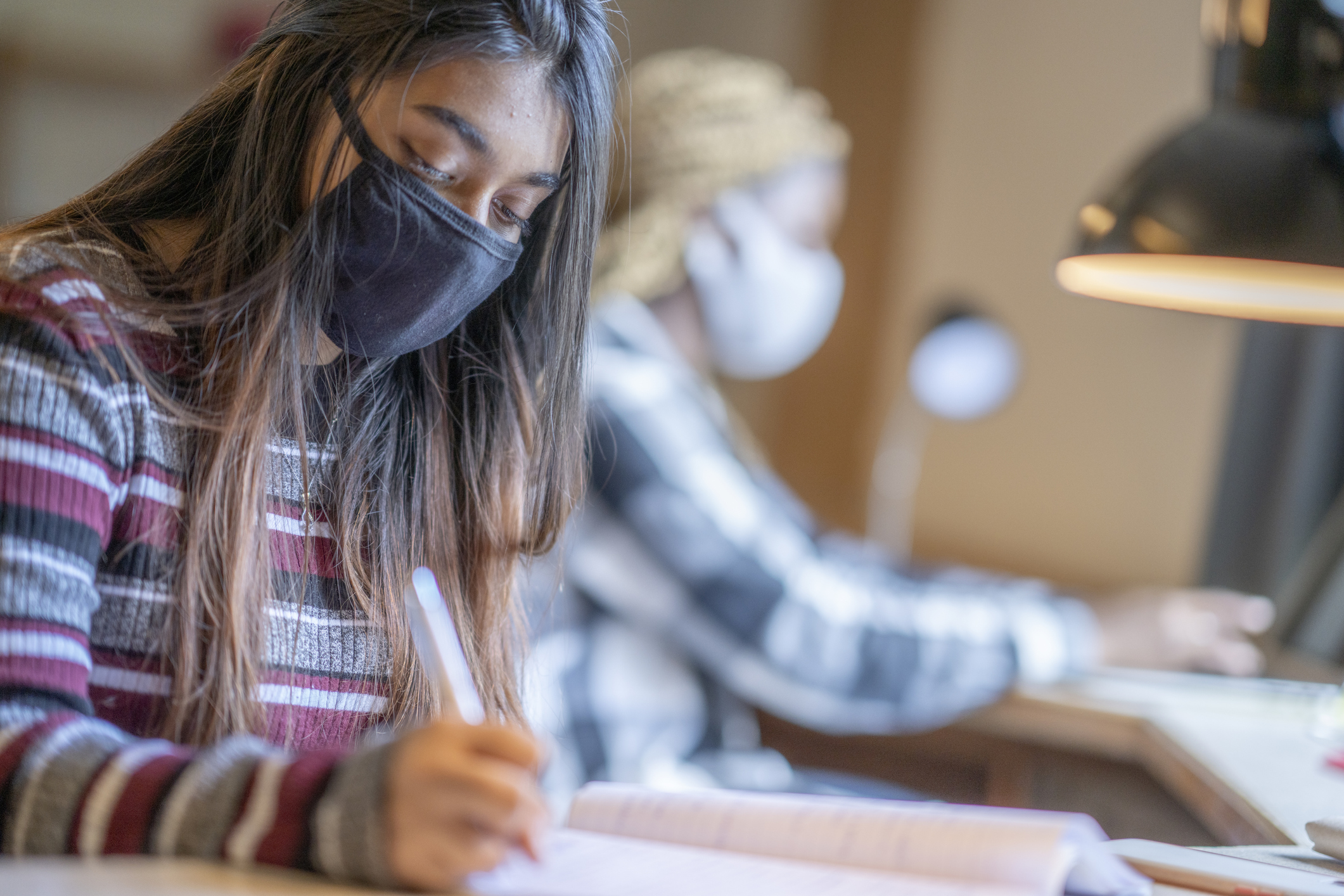 Female students working in dorm room