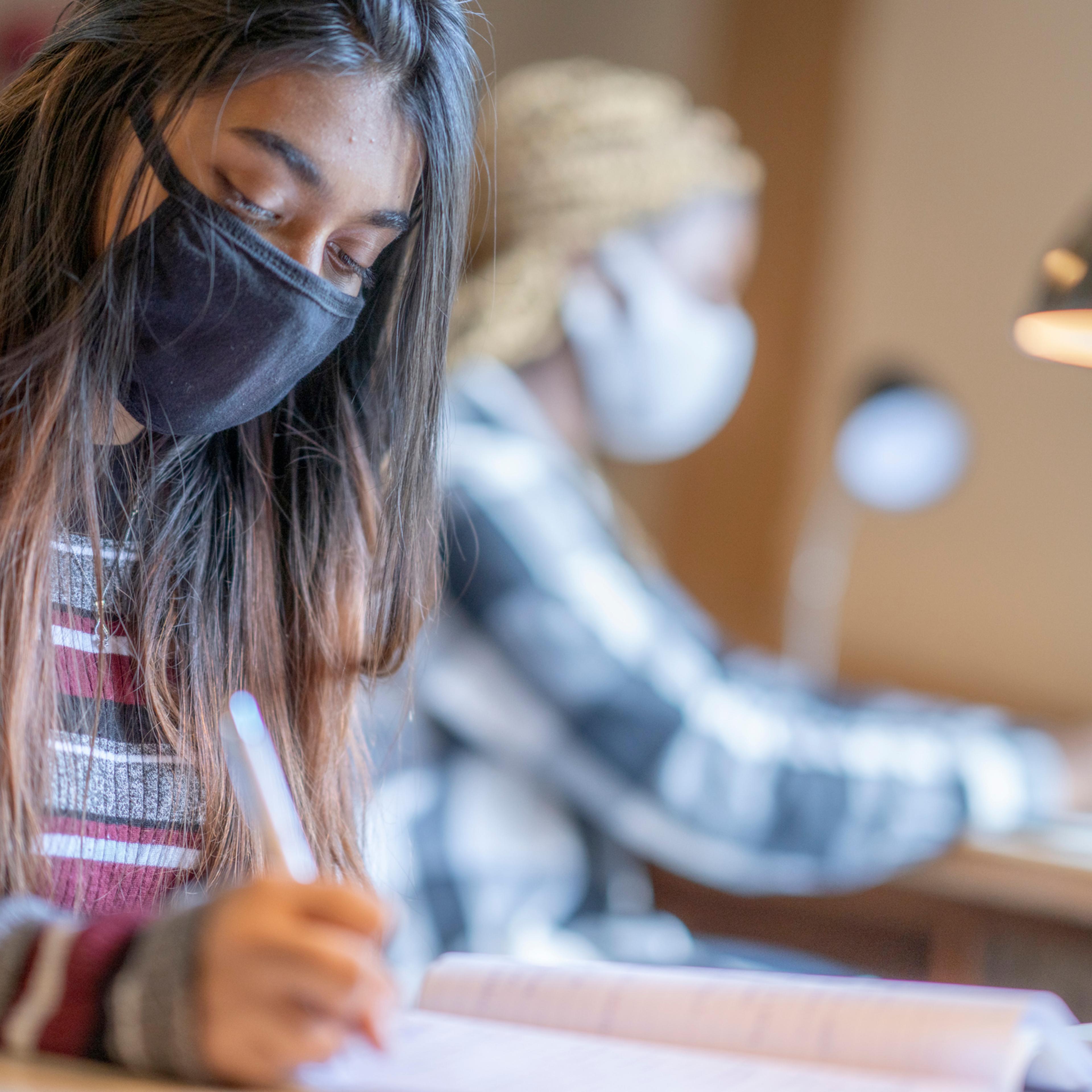 Female students working in dorm room