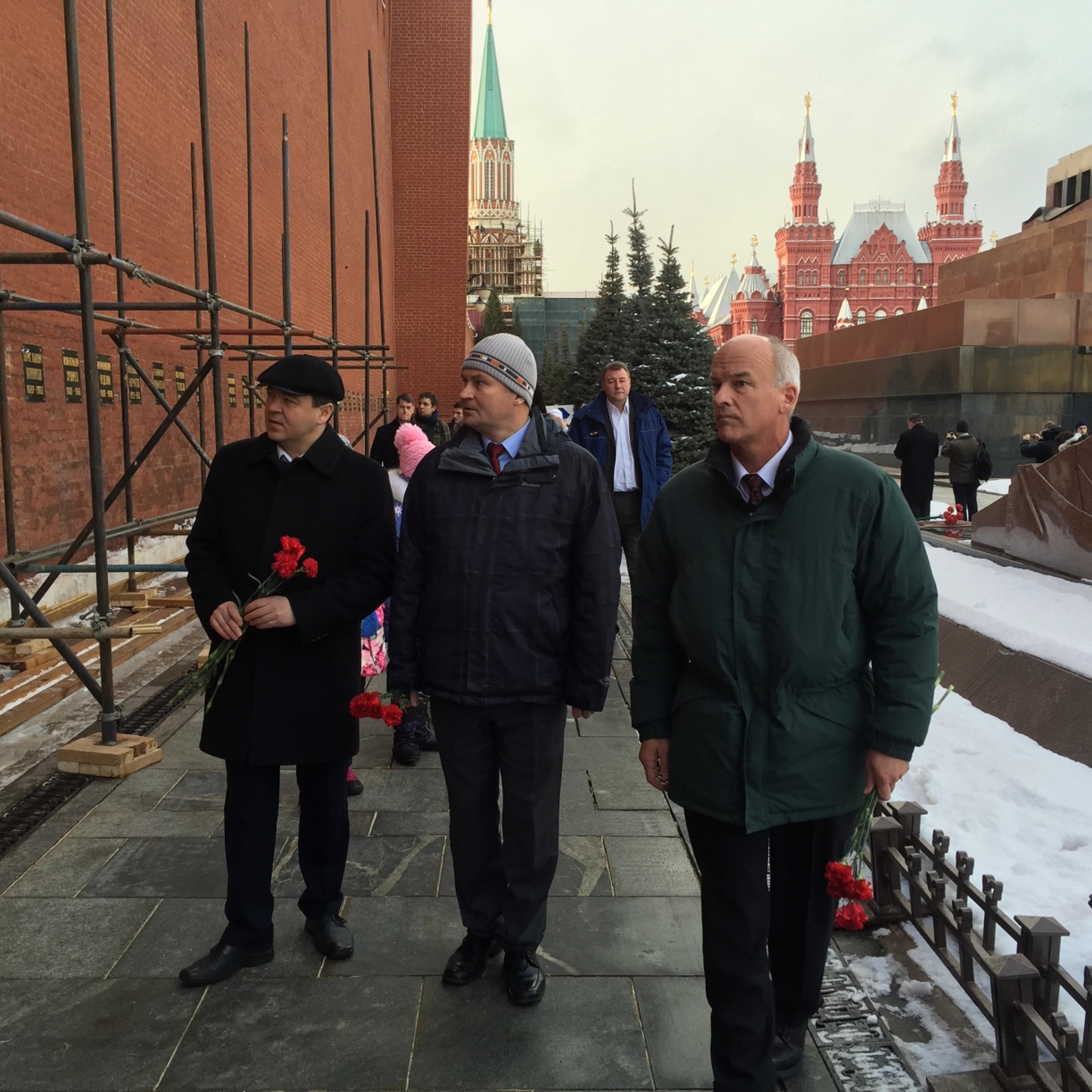 NASA astronaut Jeff Williams, right, along with Russian Cosmonauts Oleg Skripochka, left, and Alexey Ovchnin prepare for a ceremonial laying of flowers at the graves of Yuri Gagarin and Sergey Korolev outside the Kremlin near Red Square in Moscow on Friday, Feb. 26, 2016.