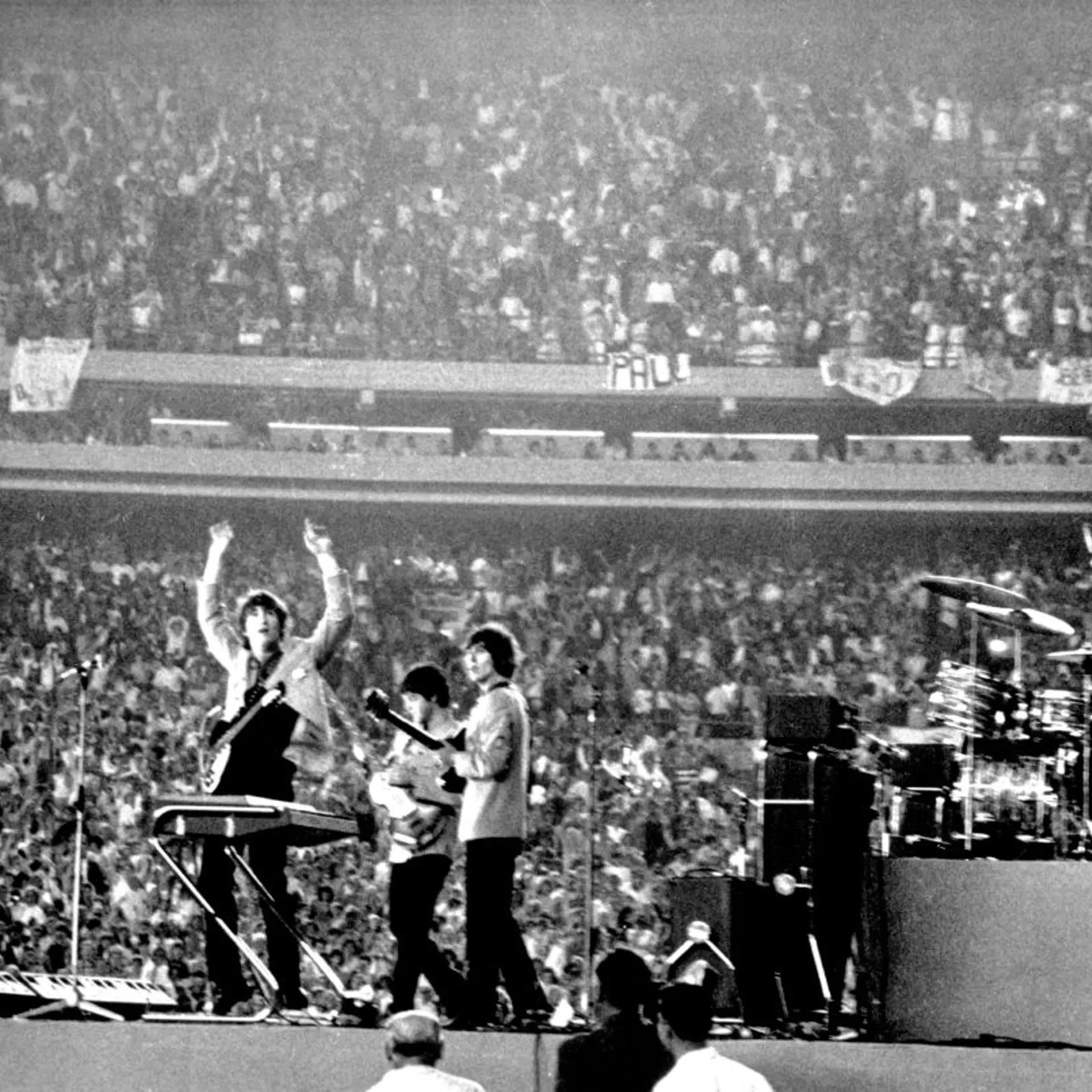 The Beatles perform at Shea Stadium