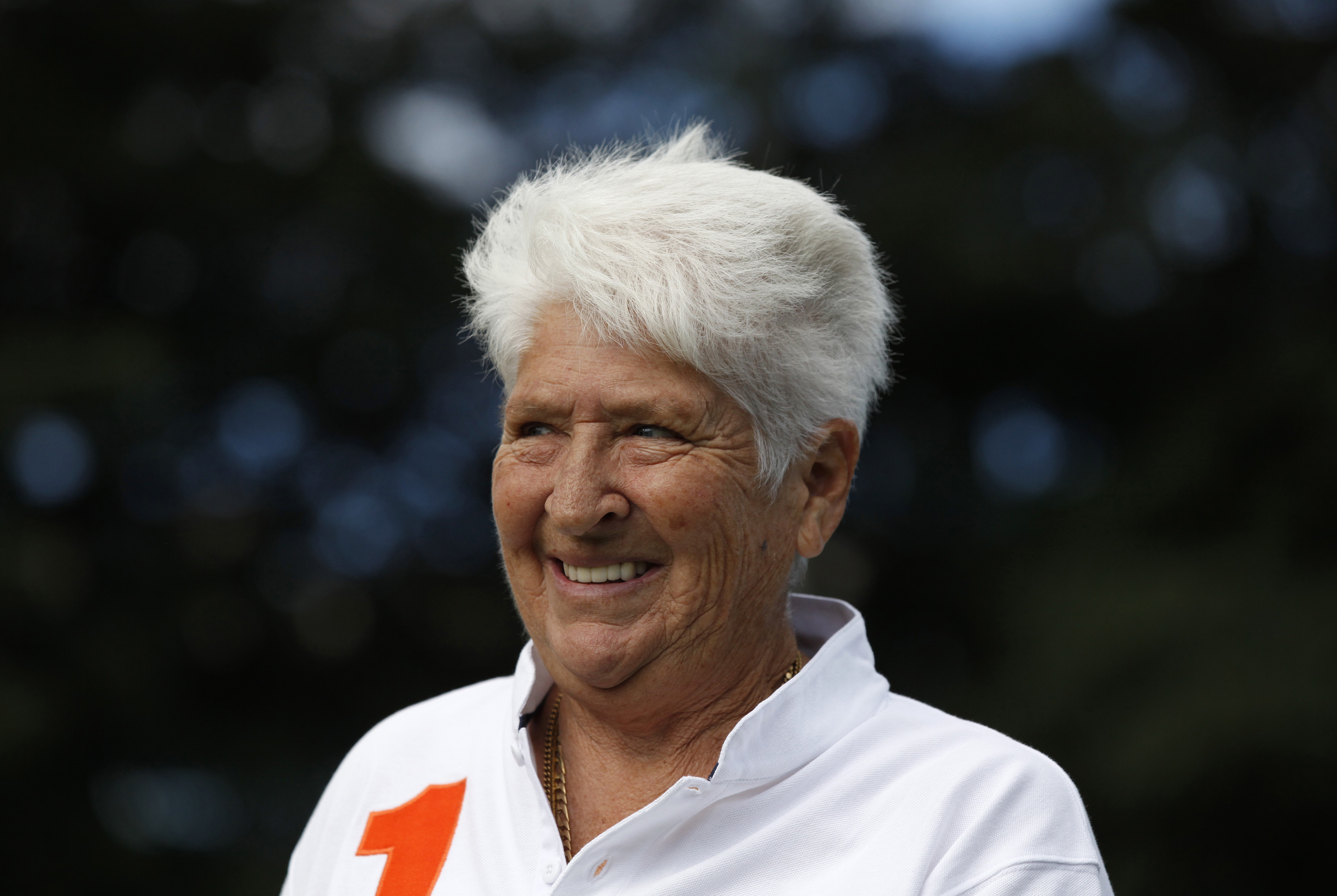 Former Australian swimmer Dawn Fraser smiles during a Reuters interview in Sydney