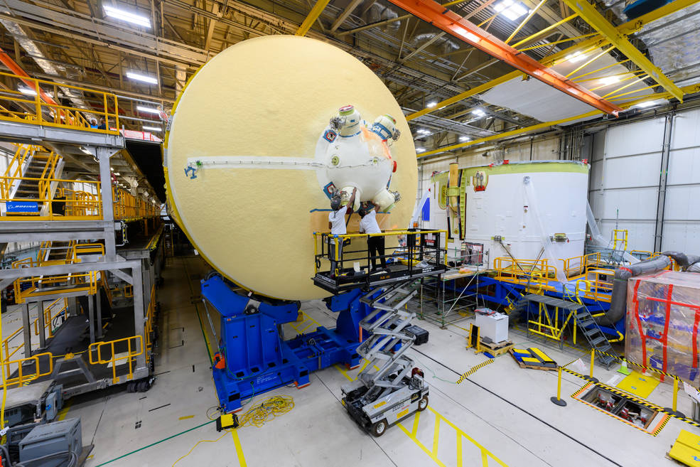 Crews at NASA's Michoud Assembly Plant work on the core stage of an SLS moon rocket