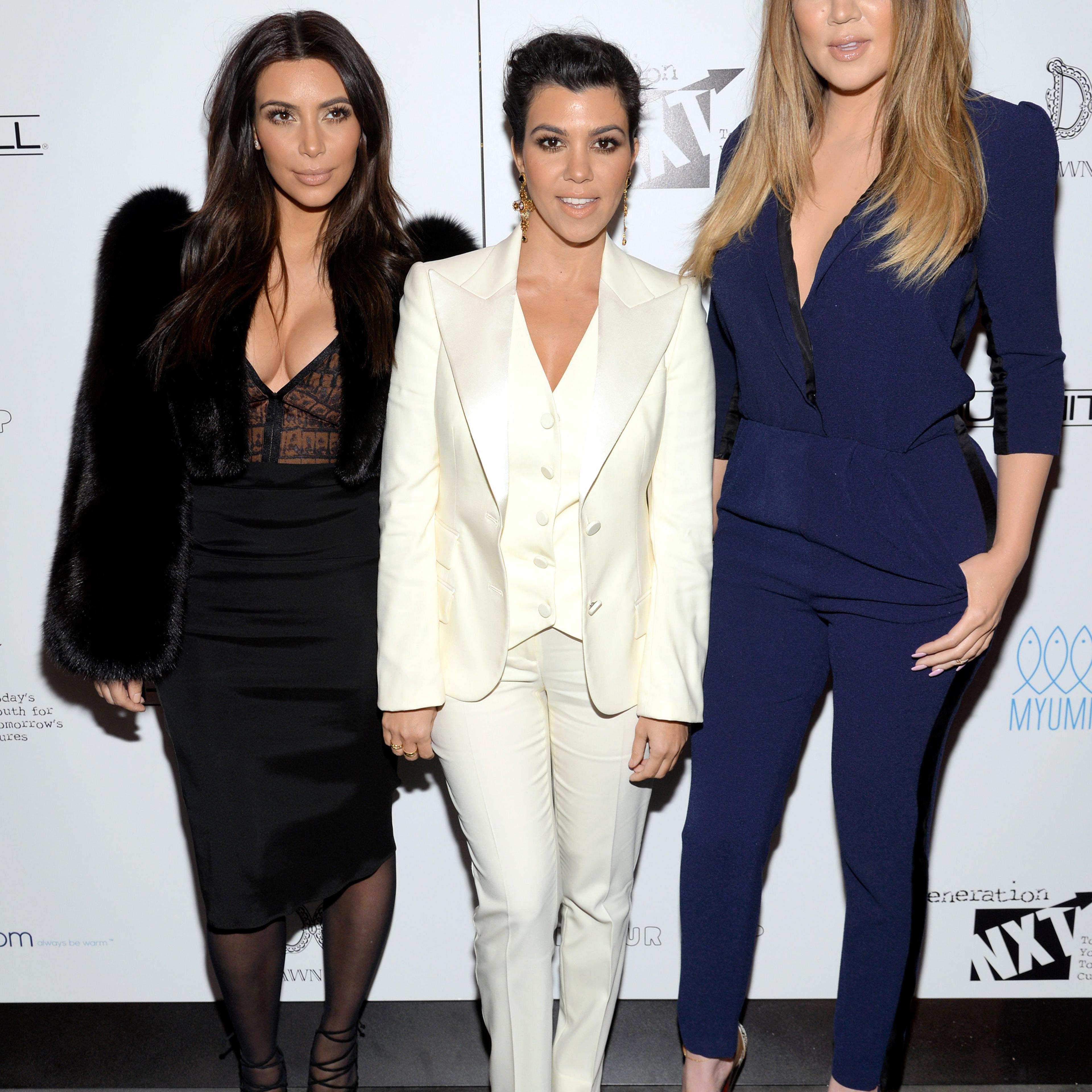 Television personalities Kim Kardashian, left, Kourtney Kardashian and Khloe Kardashian Odom, right, attend a Generation NXT Dream Foundation benefit event in New York on Feb. 16, 2014.