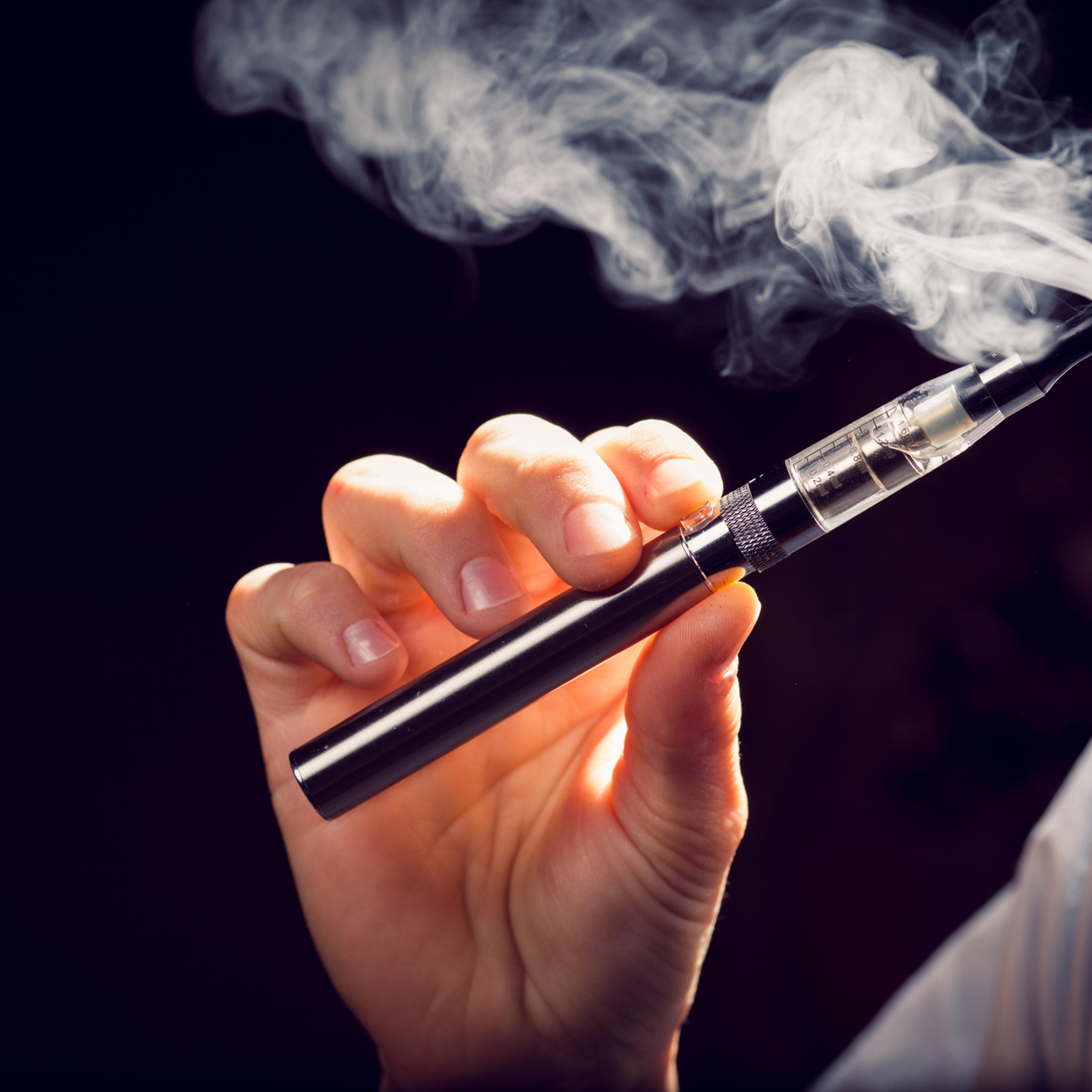 inhaling from an electronic cigarette.