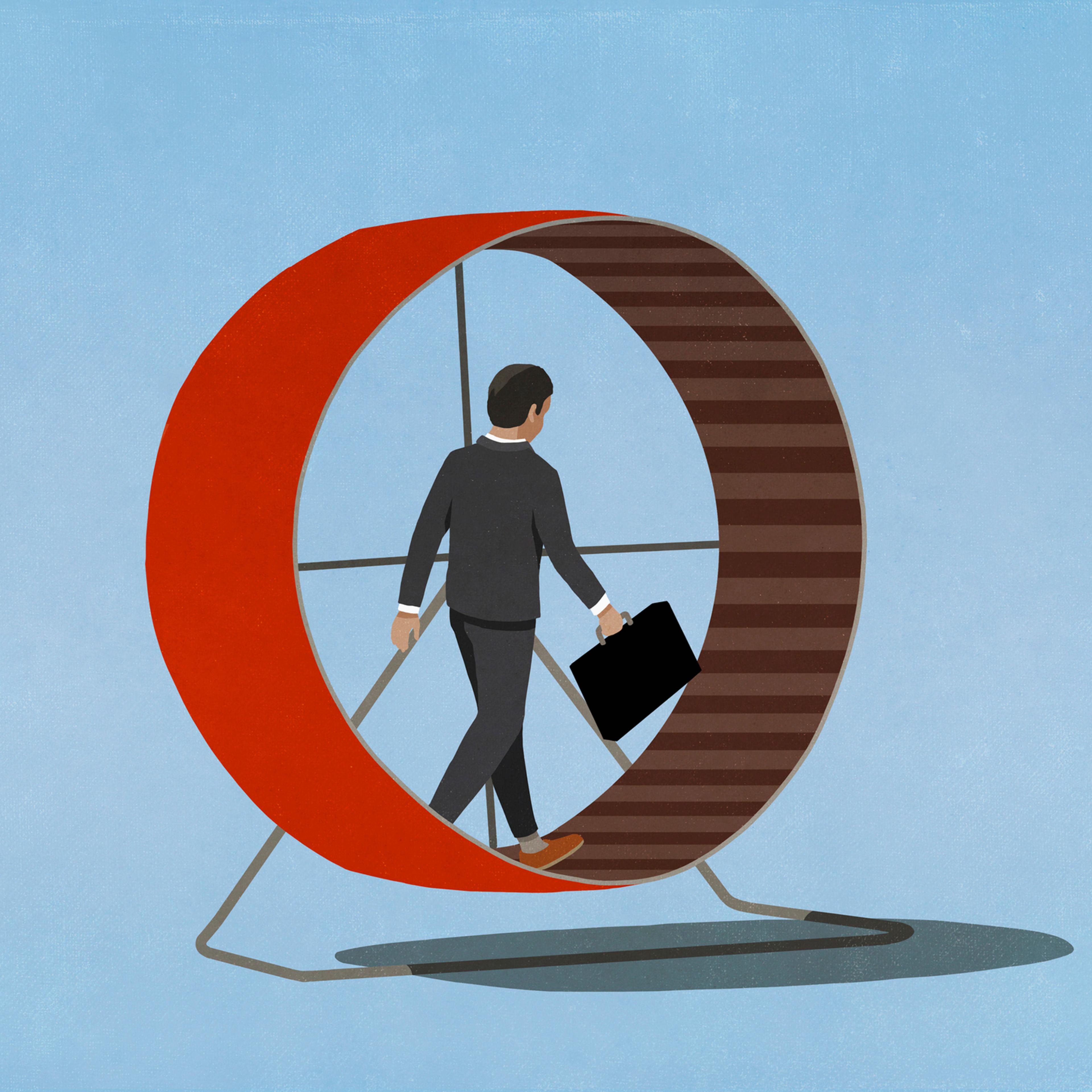 Businessman with briefcase walking in hamster wheel