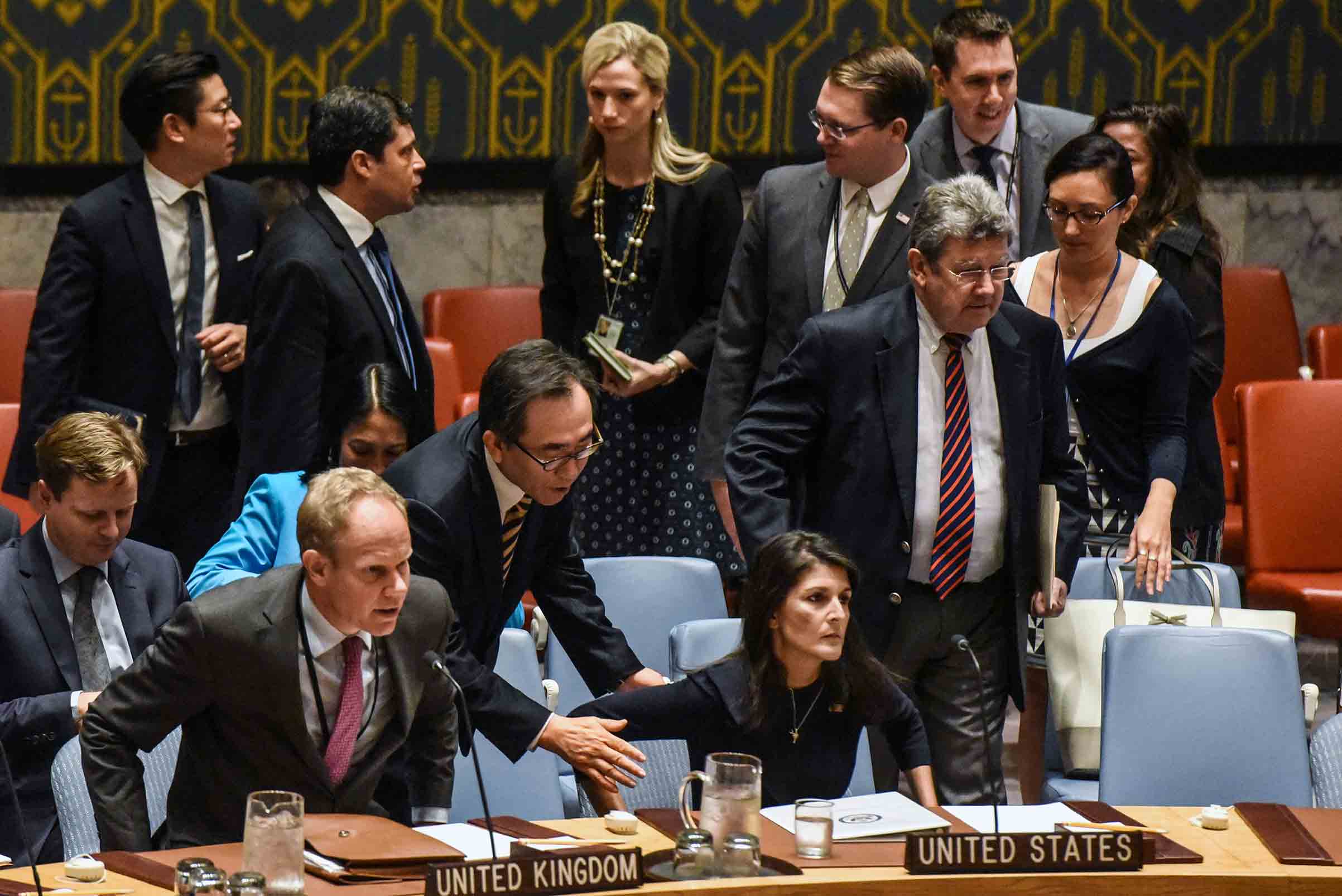 South Korean Ambassador Cho Tae-Yul tries to get the attention of Ambassador to the UN, Nikki Haley during a United Nations Security Council meeting on North Korea on Sept. 4 in New York City.