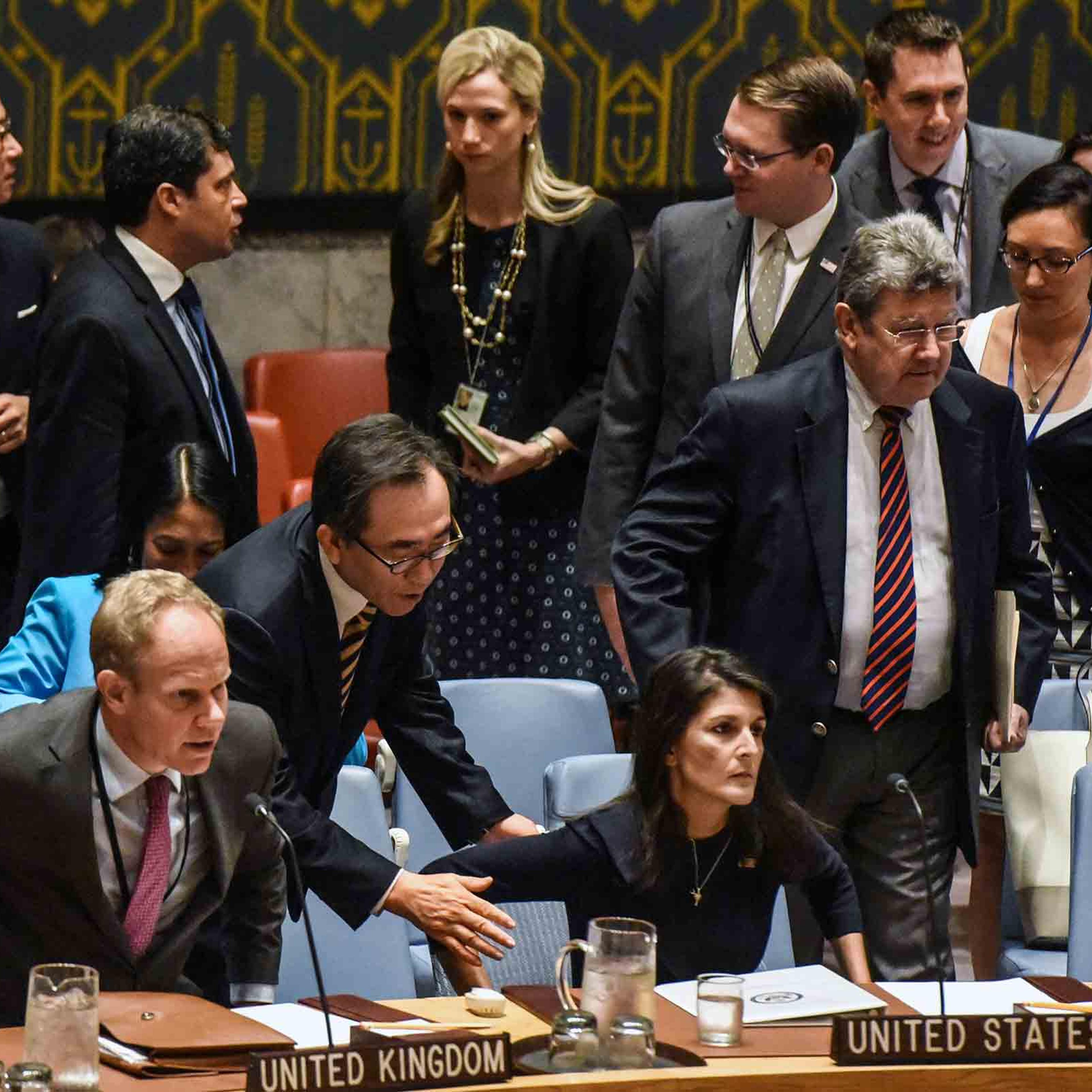South Korean Ambassador Cho Tae-Yul tries to get the attention of Ambassador to the UN, Nikki Haley during a United Nations Security Council meeting on North Korea on Sept. 4 in New York City.