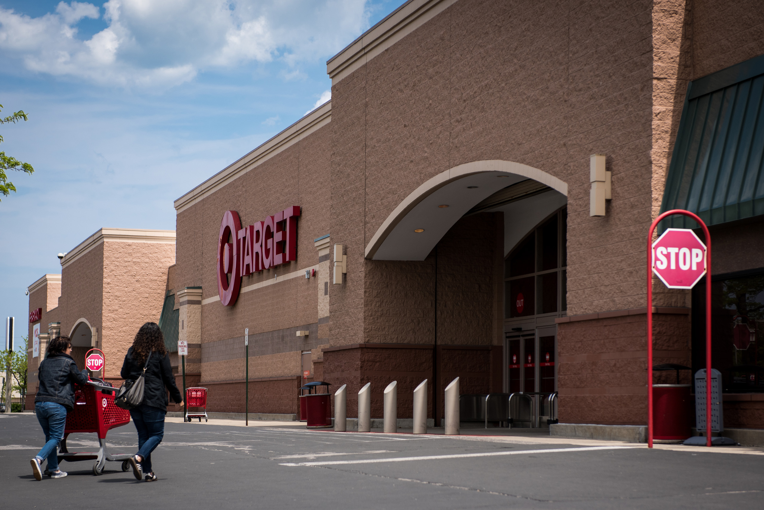 Customers push a shopping cart towards the entrance of a Target Corp. store in Chicago on May 16, 2016.