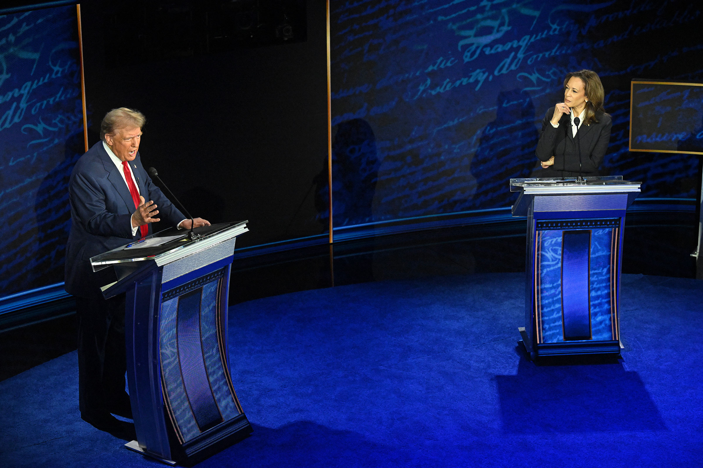 Vice President Kamala Harris listens as Trump speaks during the presidential debate in Philadelphia, Pa., on Sept. 10.