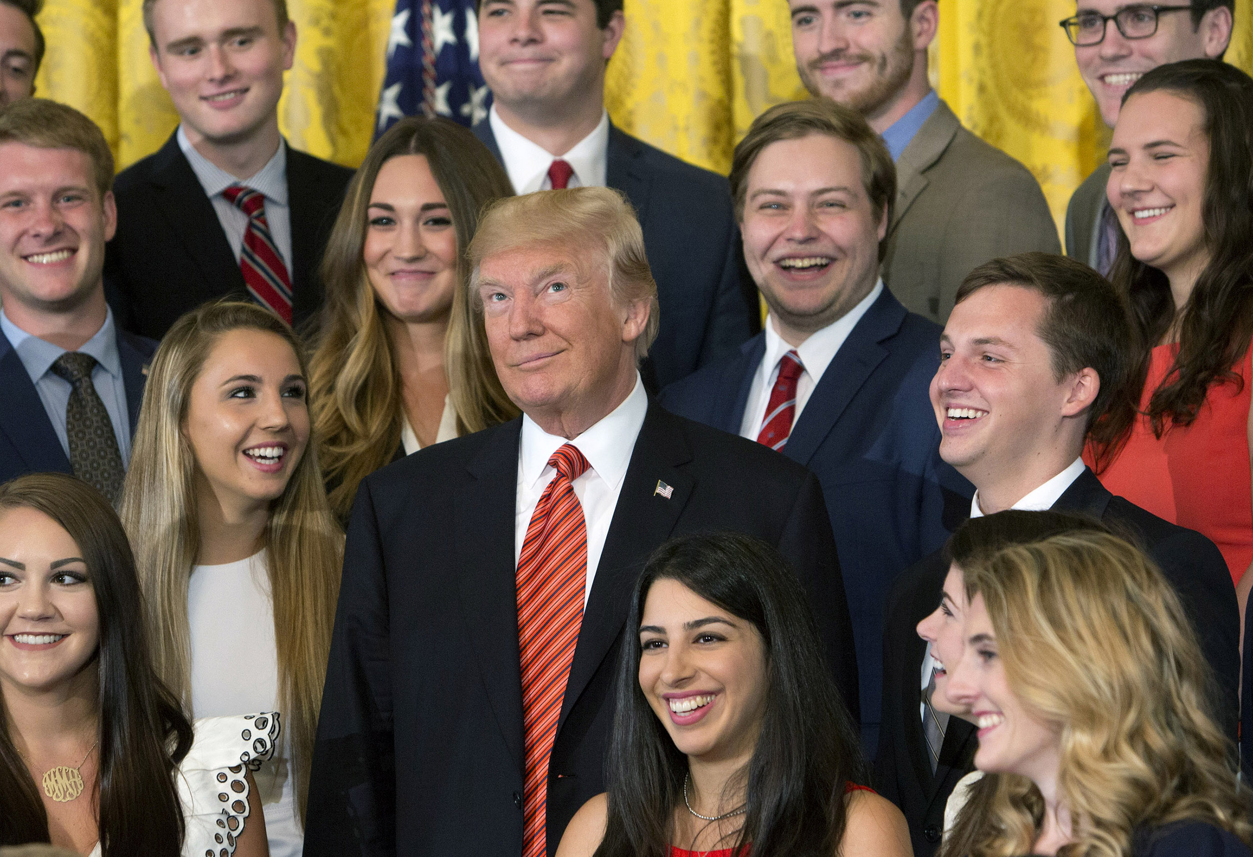 Trump Poses With Outgoing Interns