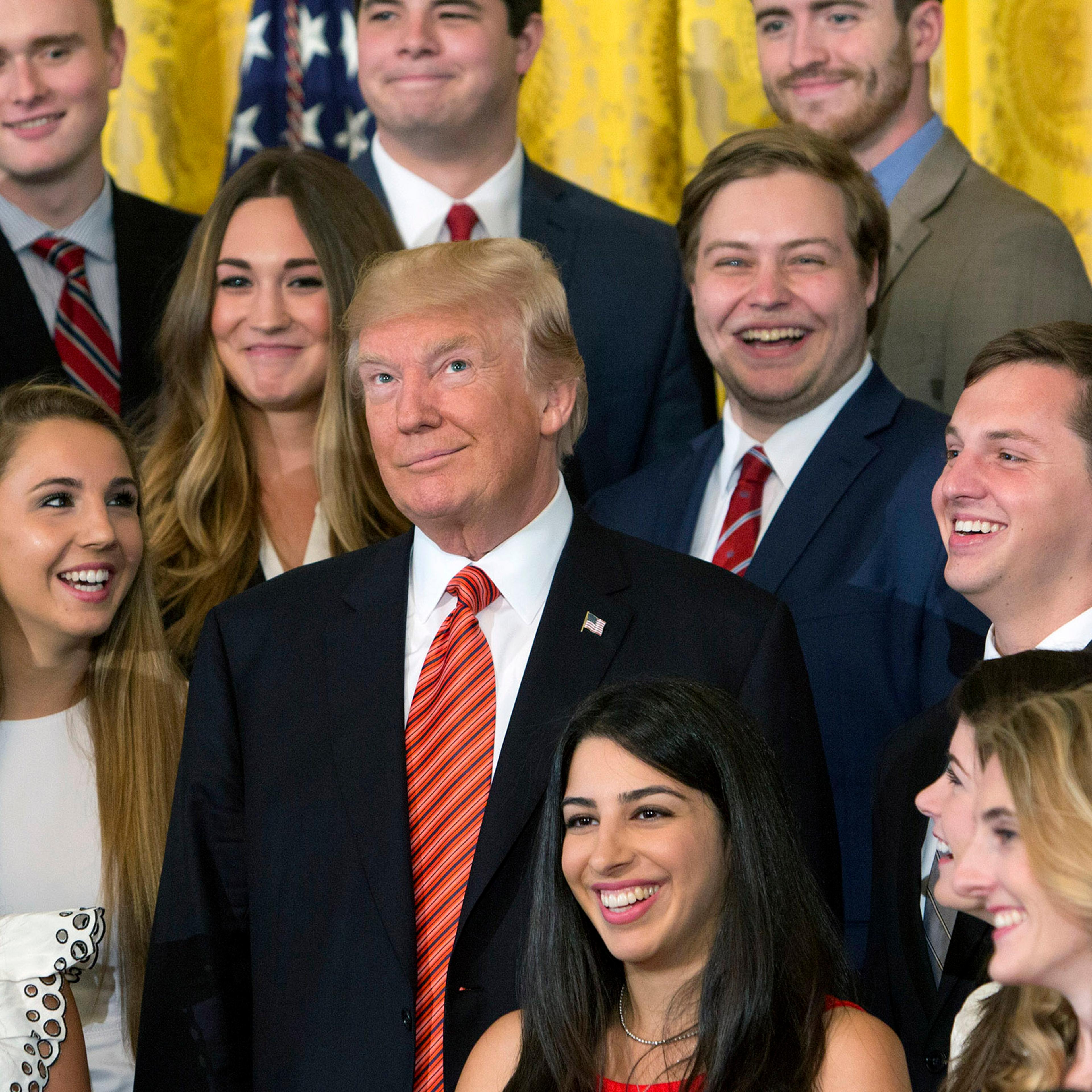 Trump Poses With Outgoing Interns
