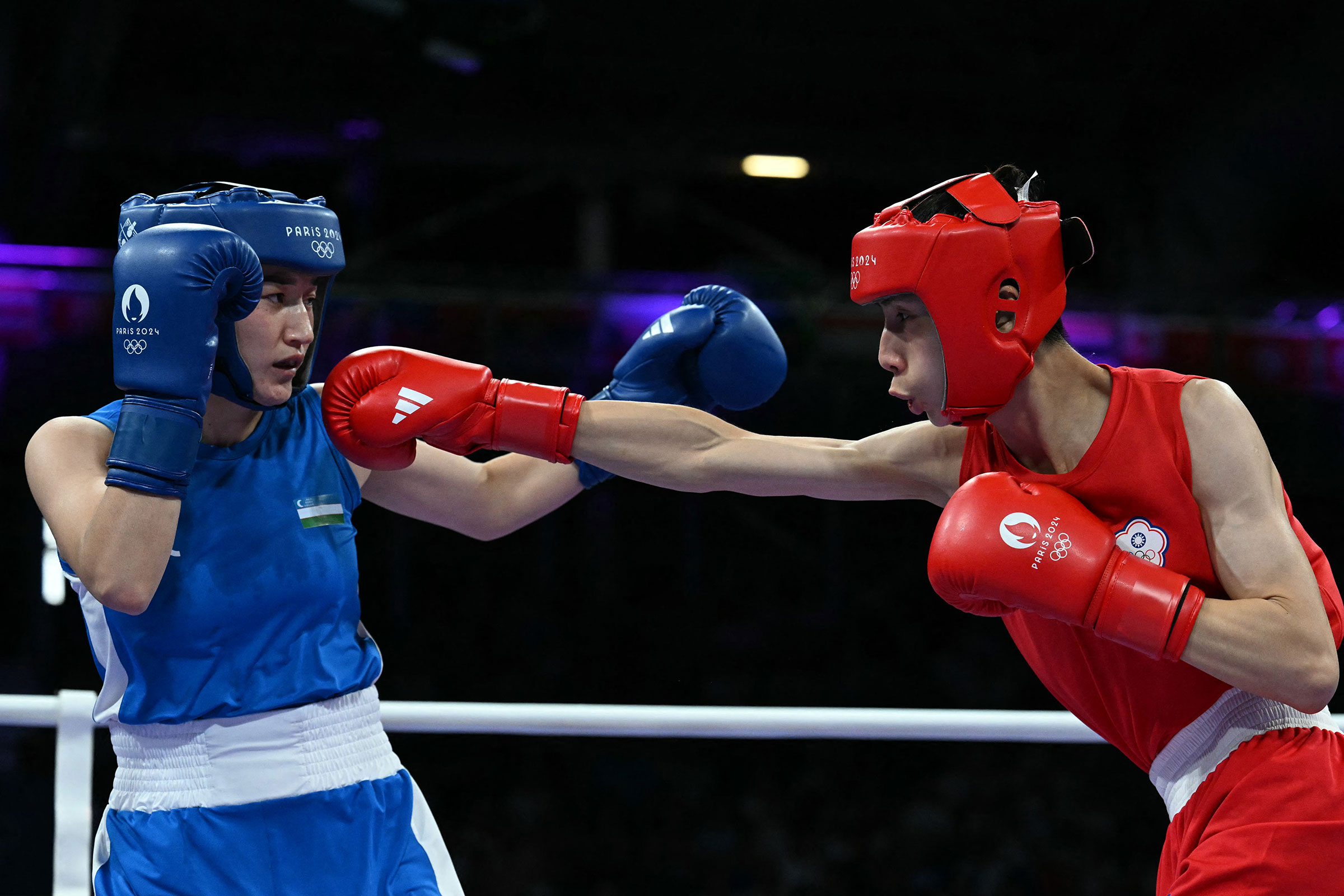 Taiwan's Lin Yu-ting, right, fights against Uzbekistan's Sitora Turdibekova, left, in the women's 57kg preliminary boxing match during the Paris 2024 Olympic Games on Aug. 2, 2024.