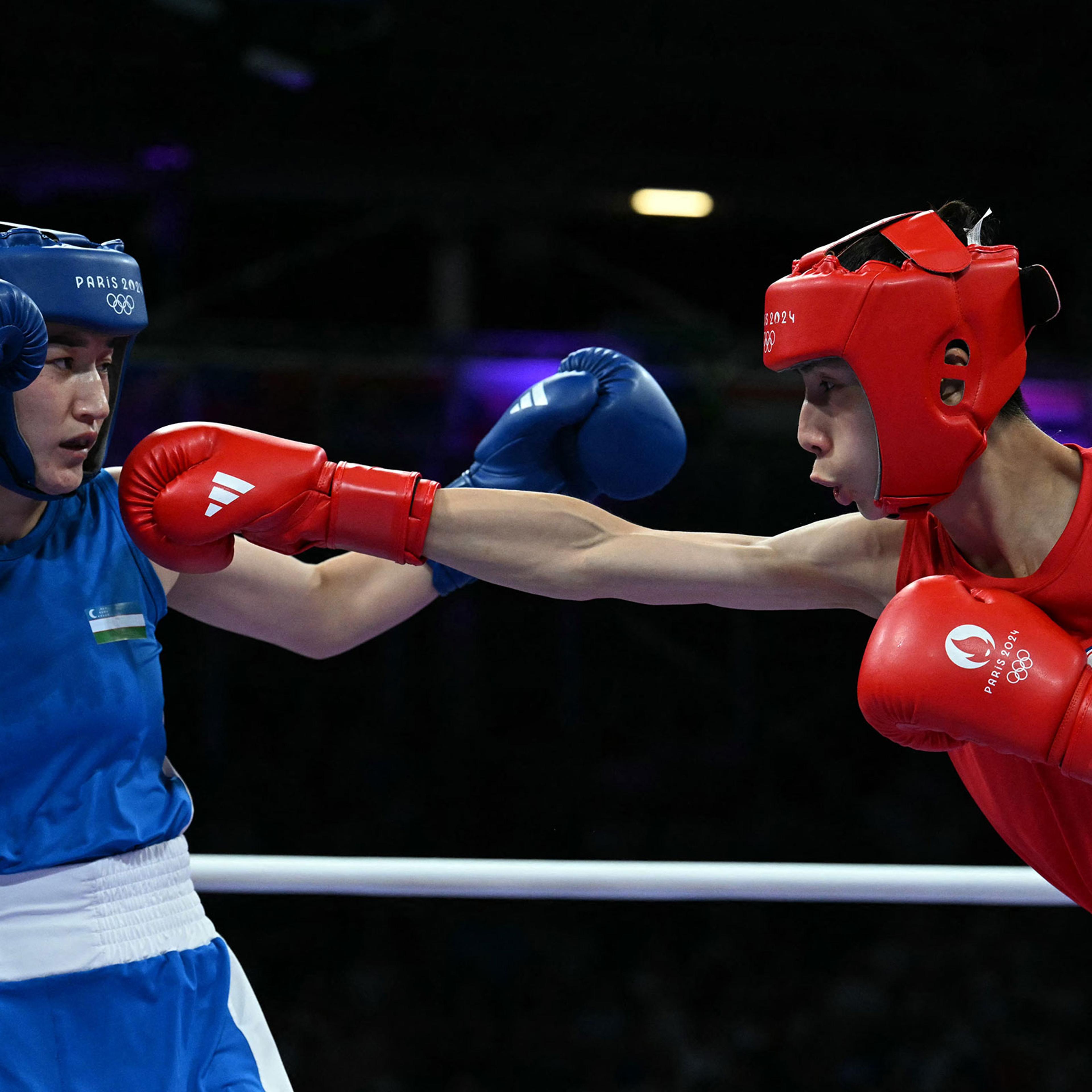 Taiwan's Lin Yu-ting, right, fights against Uzbekistan's Sitora Turdibekova, left, in the women's 57kg preliminary boxing match during the Paris 2024 Olympic Games on Aug. 2, 2024.