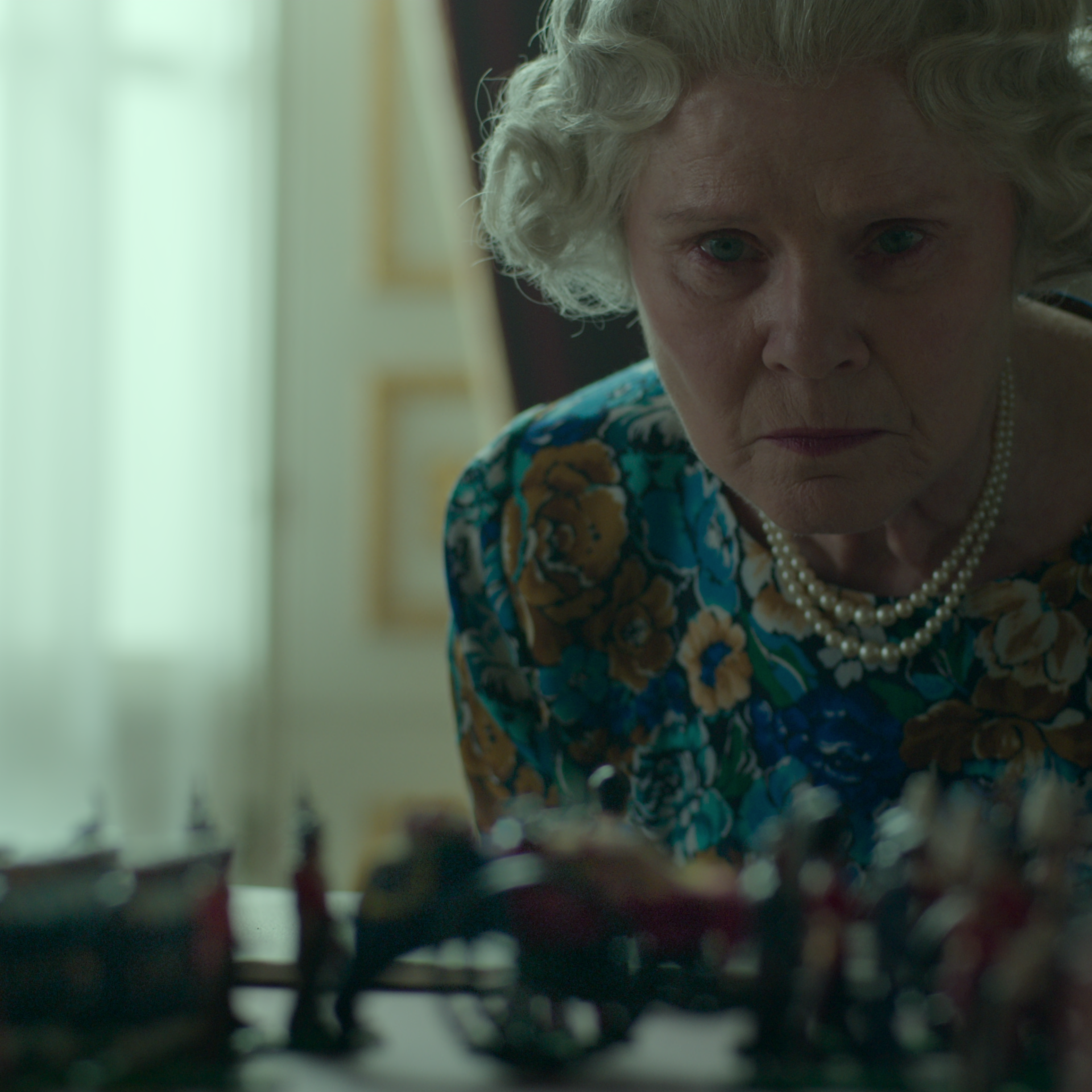 Queen Elizabeth II (Imelda Staunton) gazes as a 3D model of her planned funeral