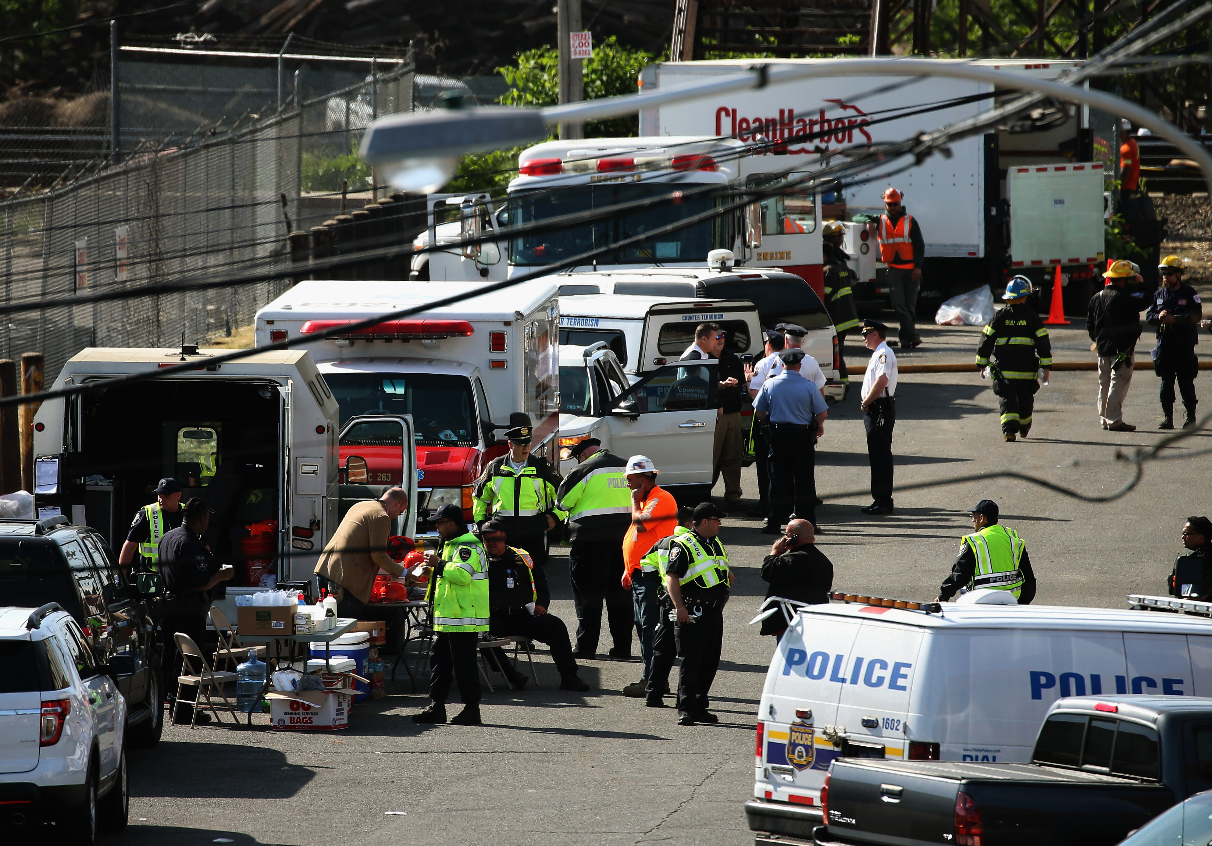Investigators and rescue personnel gather near the site of the Amtrak train derailment on May 14, 2015 in Philadelphia.