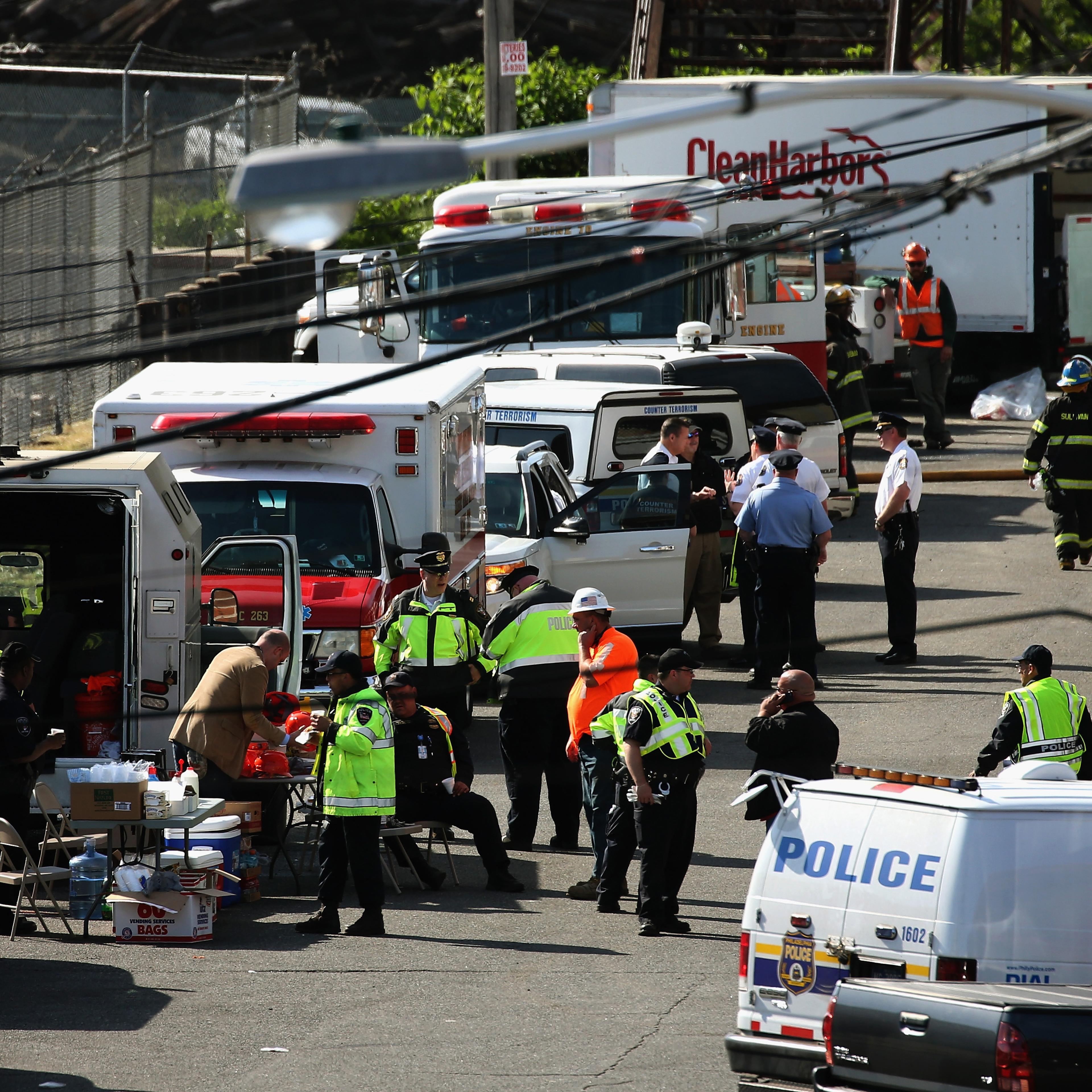 Investigators and rescue personnel gather near the site of the Amtrak train derailment on May 14, 2015 in Philadelphia.